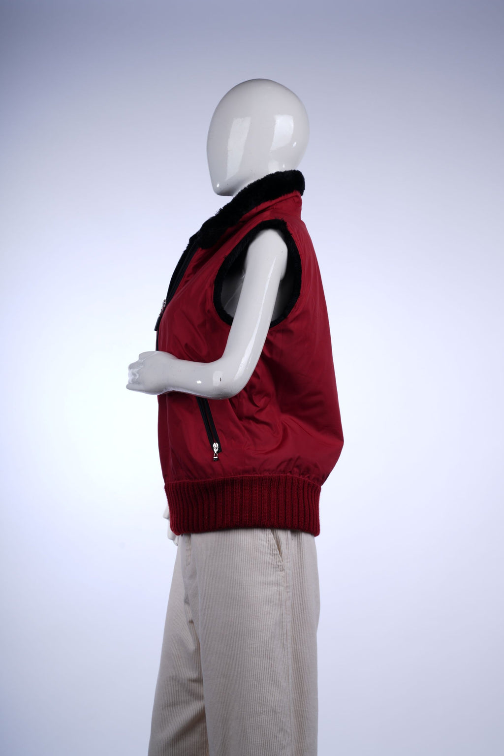 Casual red vest with black faux fur trim, ideal for layering over sweaters or tops.