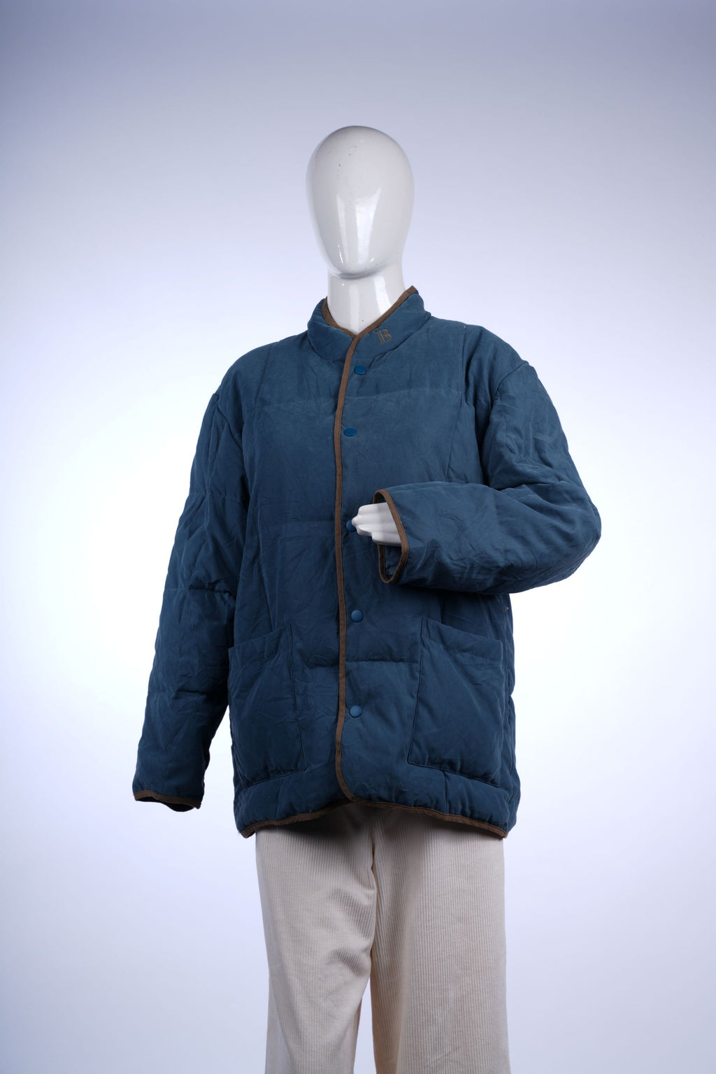 Warm and stylish Balmain jacket featuring quilted design and iconic logo on the collar.