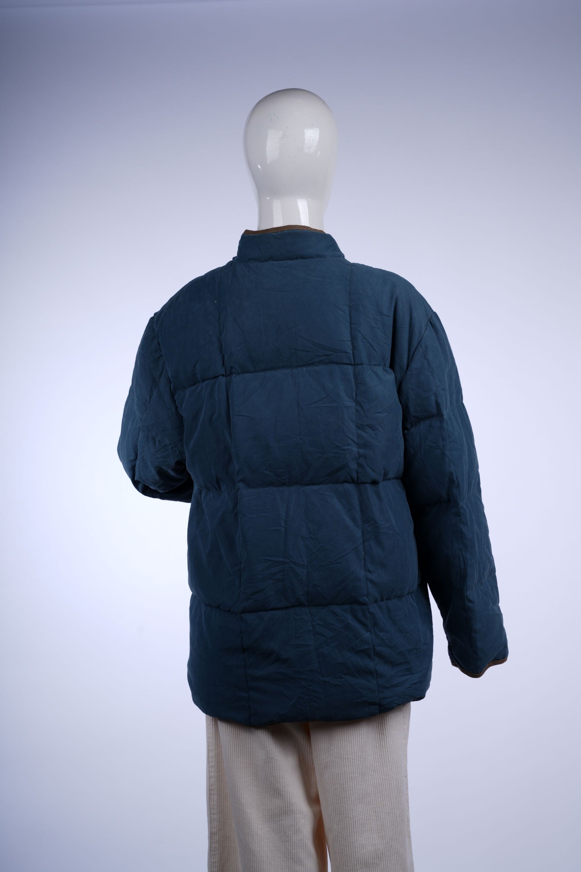 Stand-up collar quilted jacket by Balmain, offering warmth and a luxury casual look.