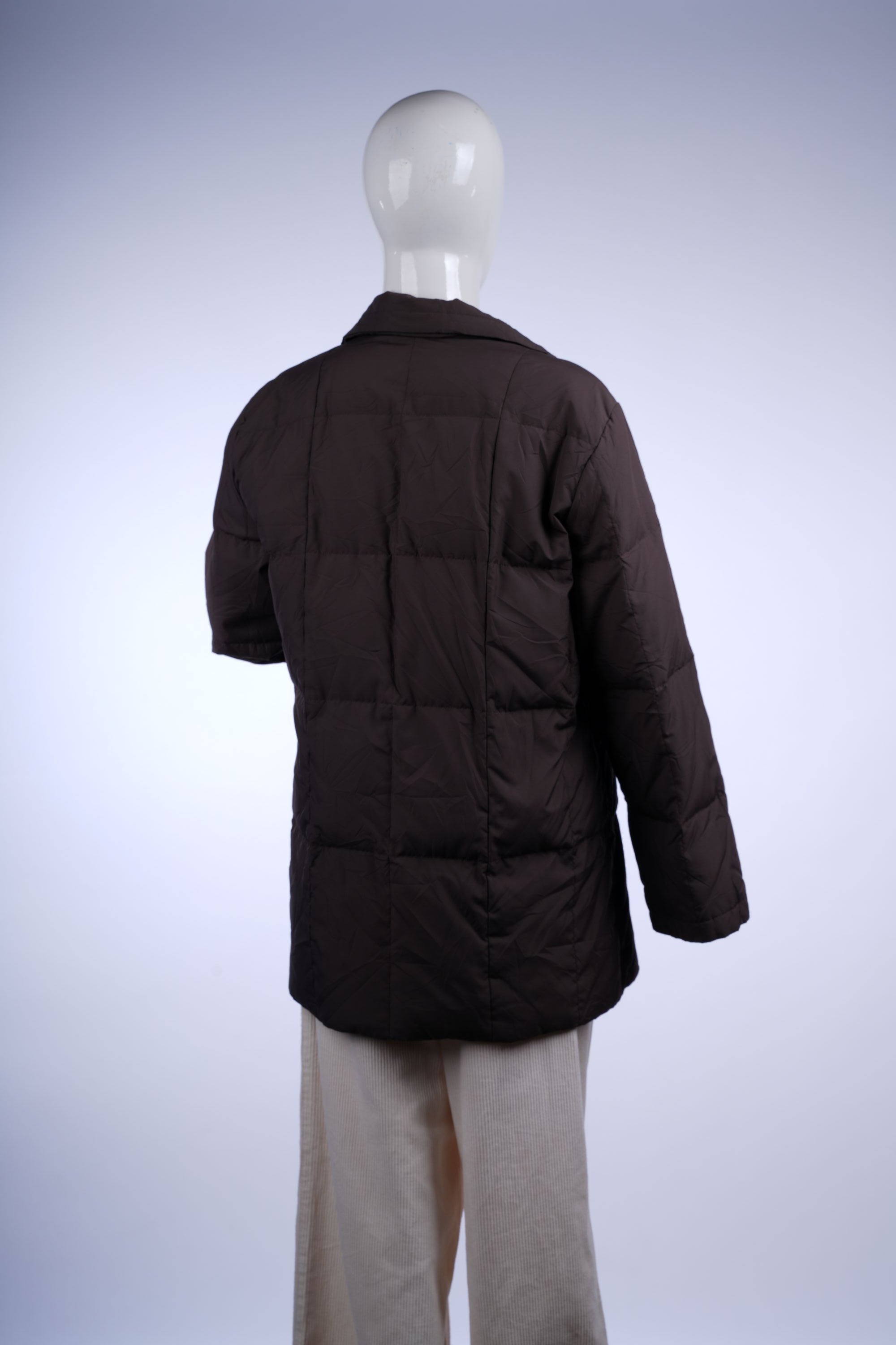 Insulated brown puffer coat with stand-up collar and mid-thigh length for cozy winter wear.