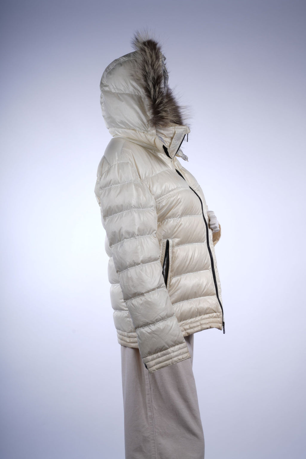 Stylish black puffer coat with fur-trimmed hood and Nova Check lining, perfect for cold-weather sophistication.