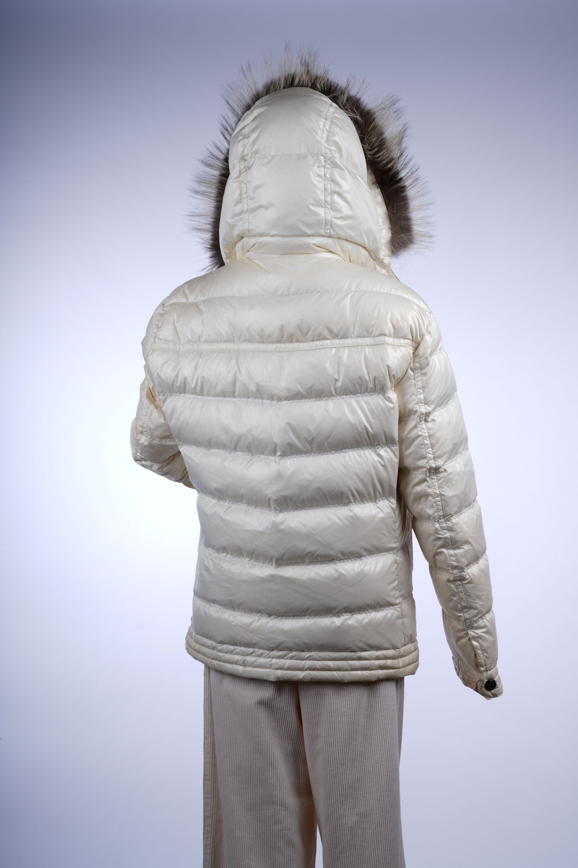 Burberry Black Label winter jacket with cozy fur hood and quilted insulation, showcasing classic British design.