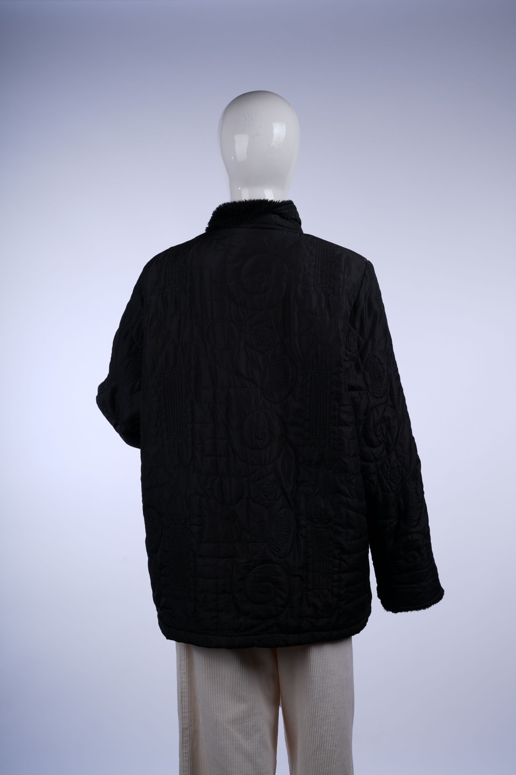 Warm black jacket with quilted pattern, front pockets, and plush faux fur collar, ideal for cold-weather wear.