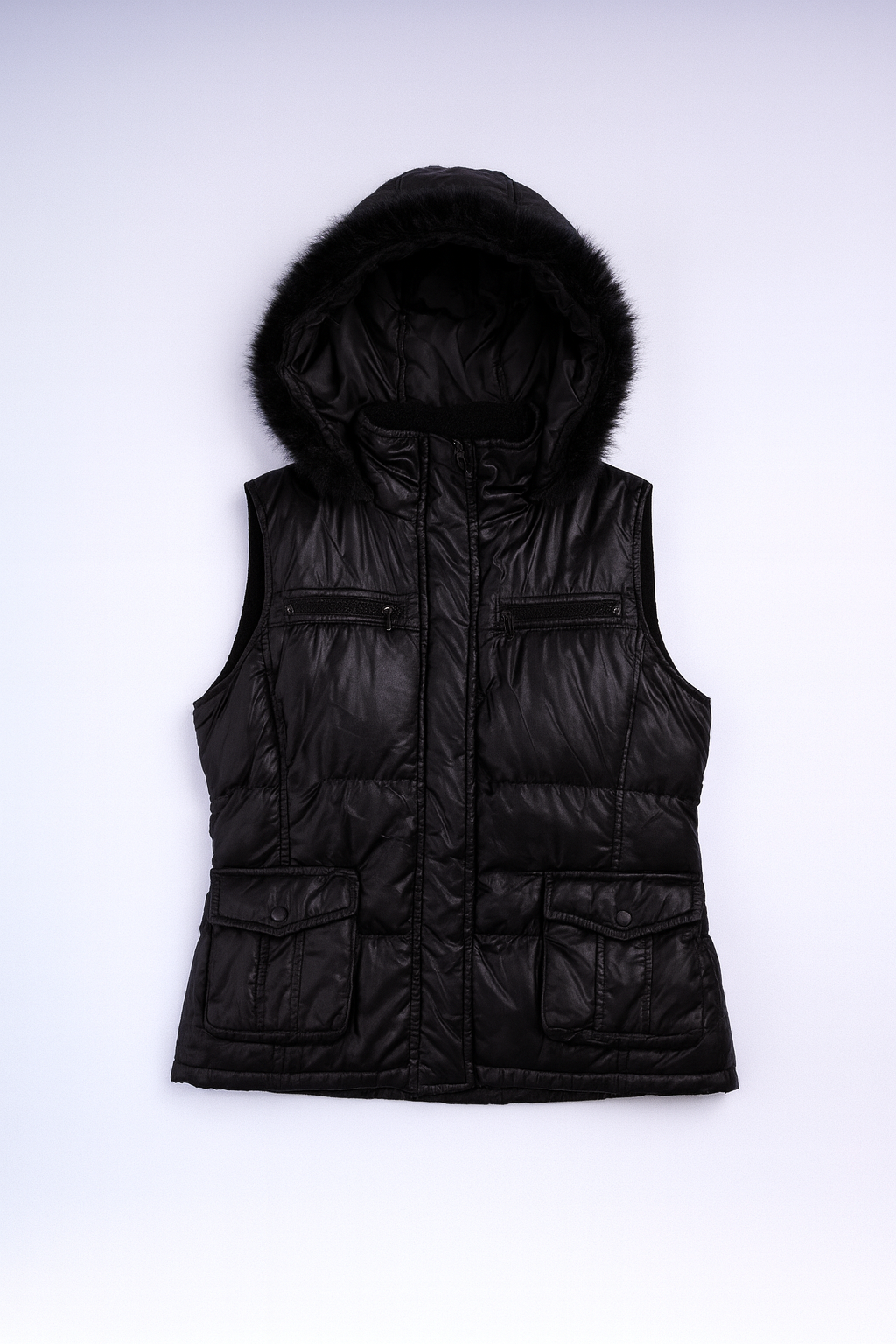 Black puffer vest with fur trim, multiple pockets, and zip-front closure for stylish, warm layering.
