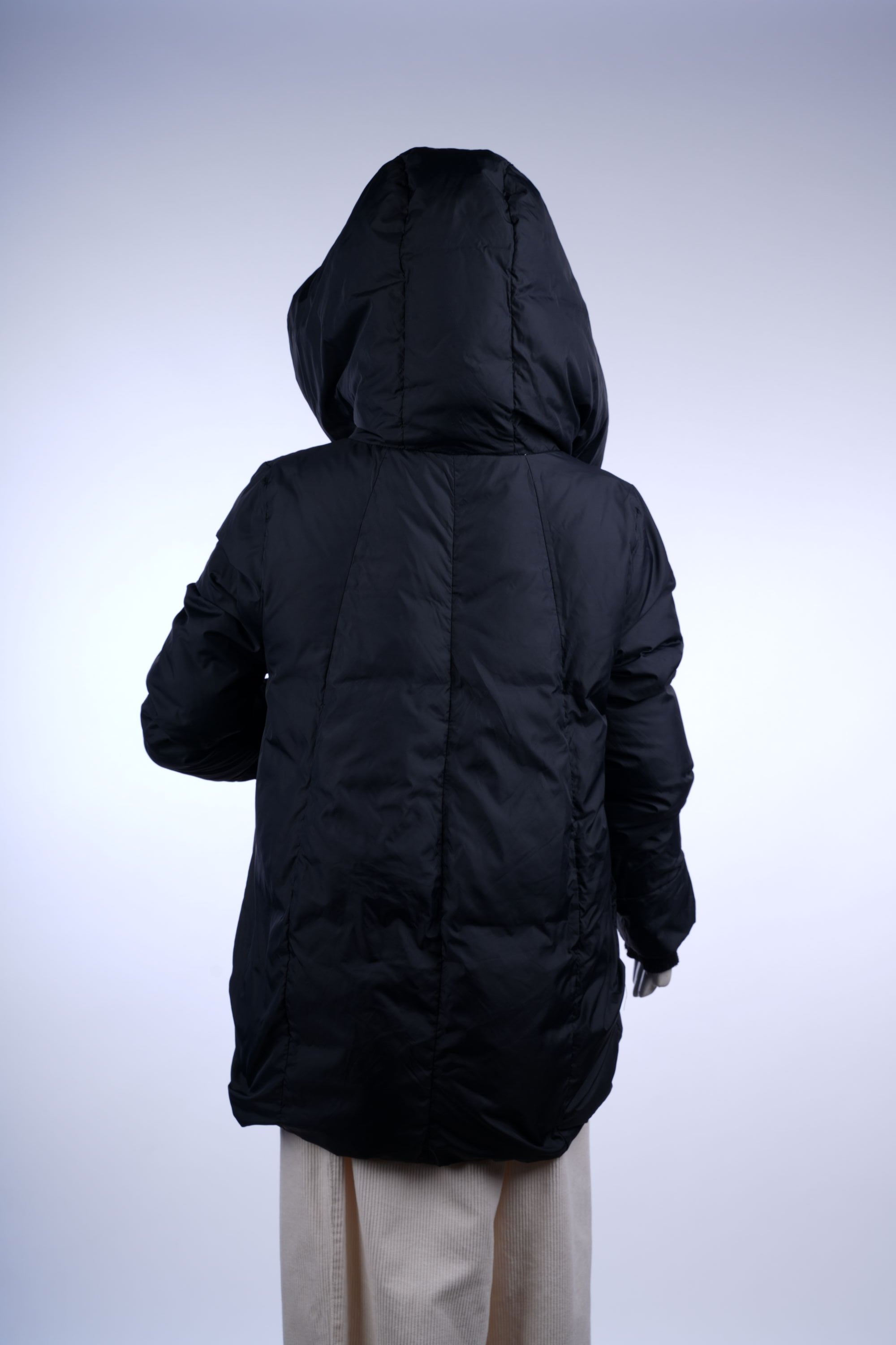 Stylish long puffer coat with quilted insulation, high collar, and zip-front closure for cold-weather comfort.