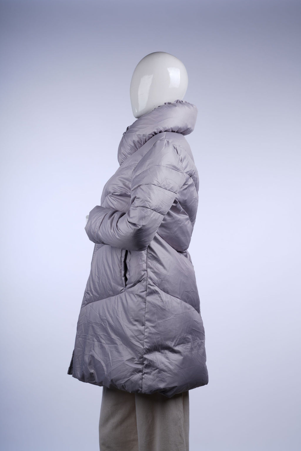 Insulated light grey puffer coat featuring a stand-up collar and full-length zipper, ideal for chilly days.