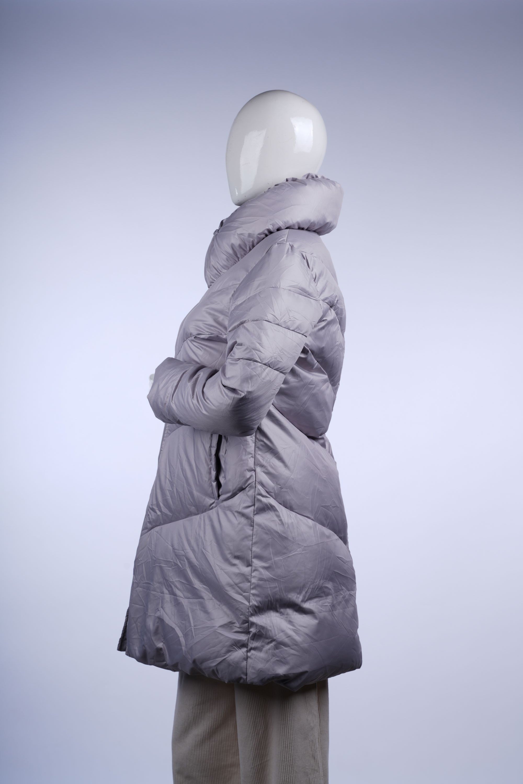 Insulated light grey puffer coat featuring a stand-up collar and full-length zipper, ideal for chilly days.
