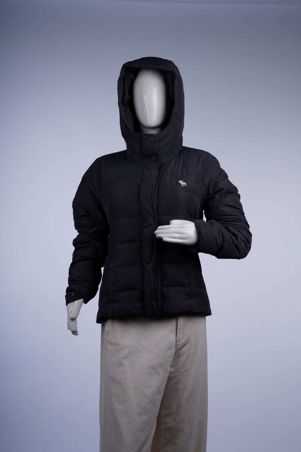 Warm and versatile dark grey/black puffer jacket with zip-front and quilted design, ideal for winter layering.