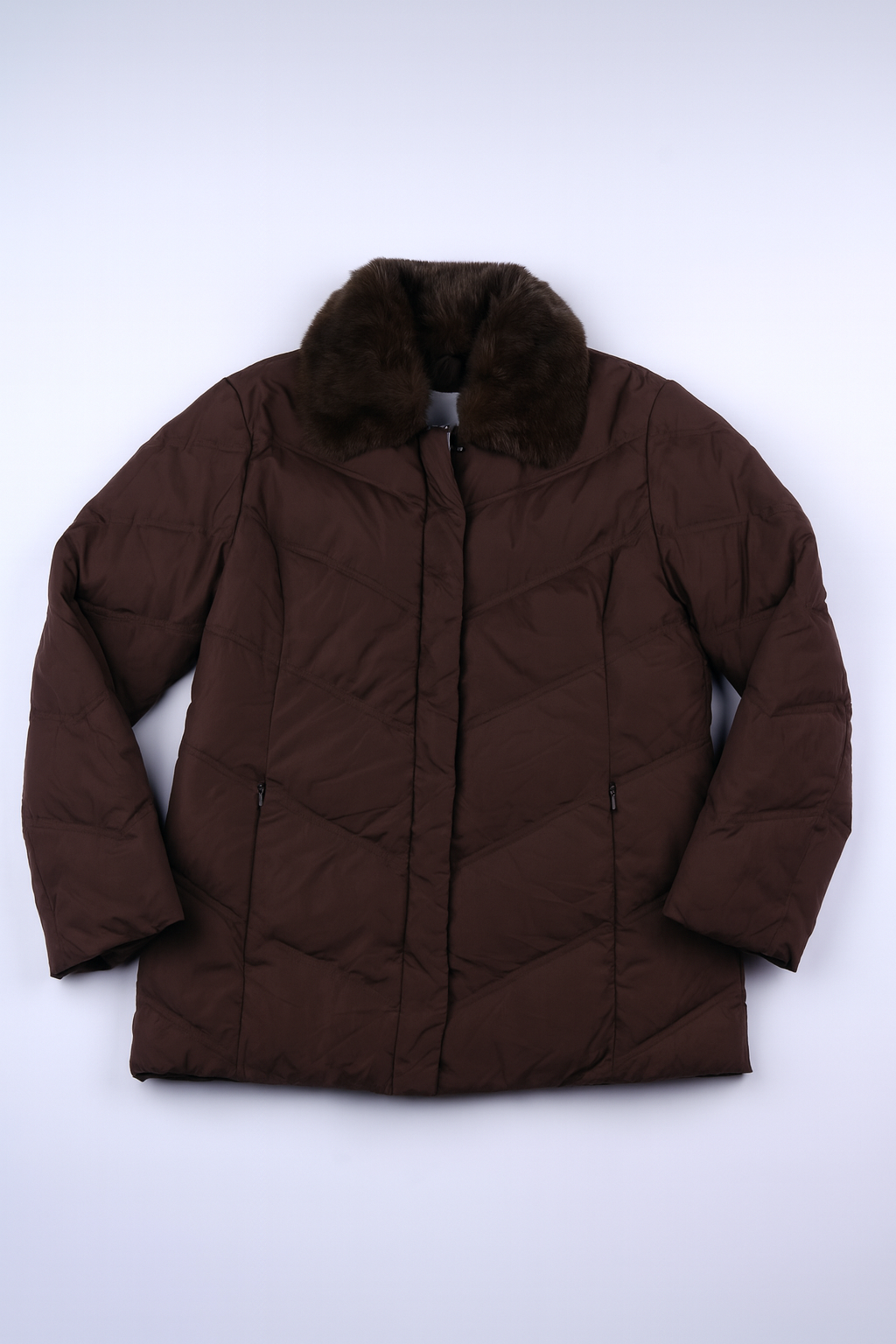 Brown quilted puffer jacket with plush faux fur collar and full-zip closure, insulated for warmth.