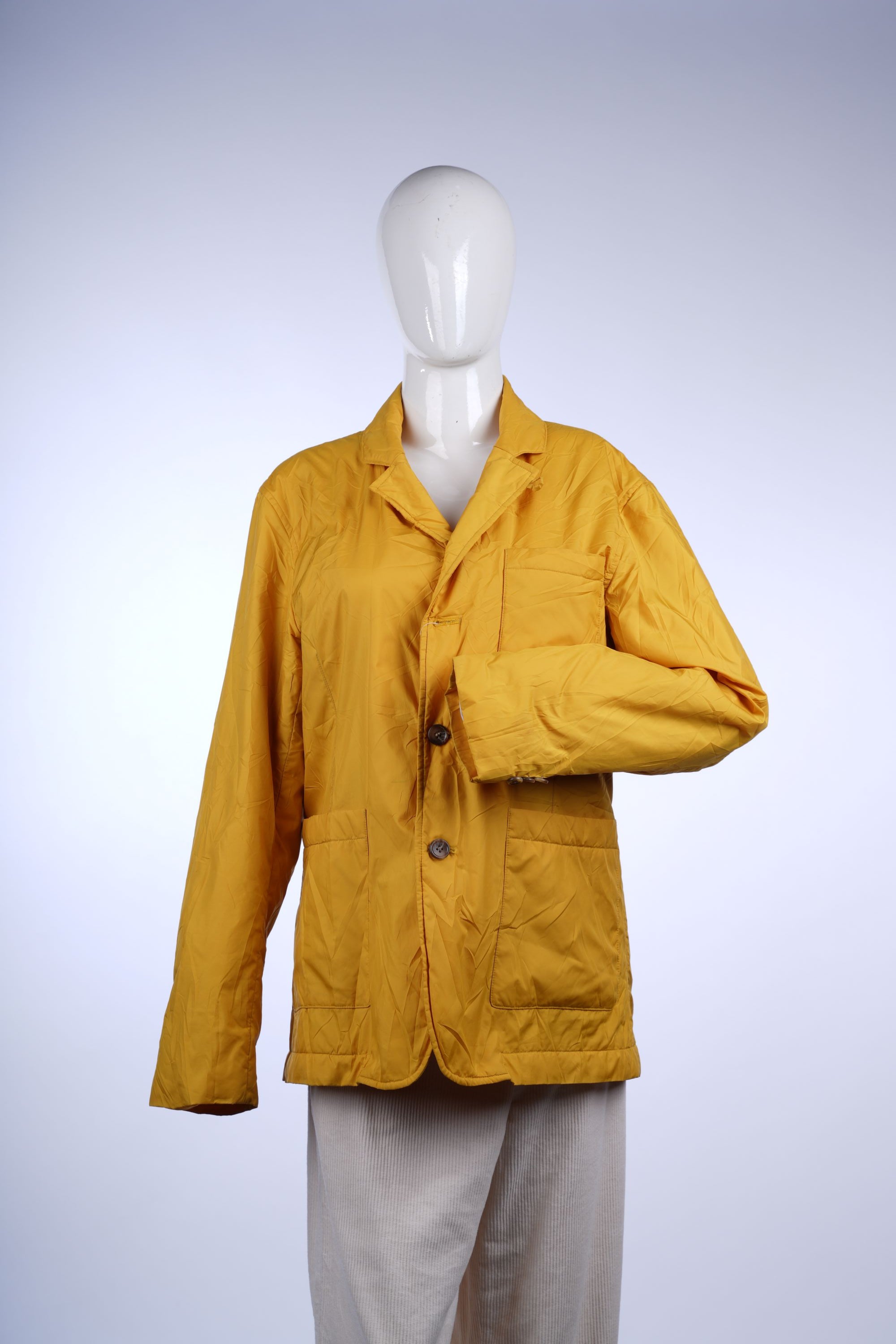 Lightweight mustard yellow jacket featuring a classic collar, button-down front, and functional pockets for casual wear.