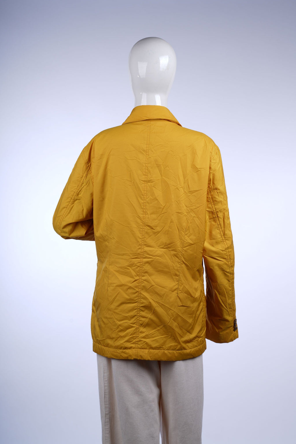 Versatile mustard yellow jacket with button-front design, practical pockets, and a classic collar for everyday style.