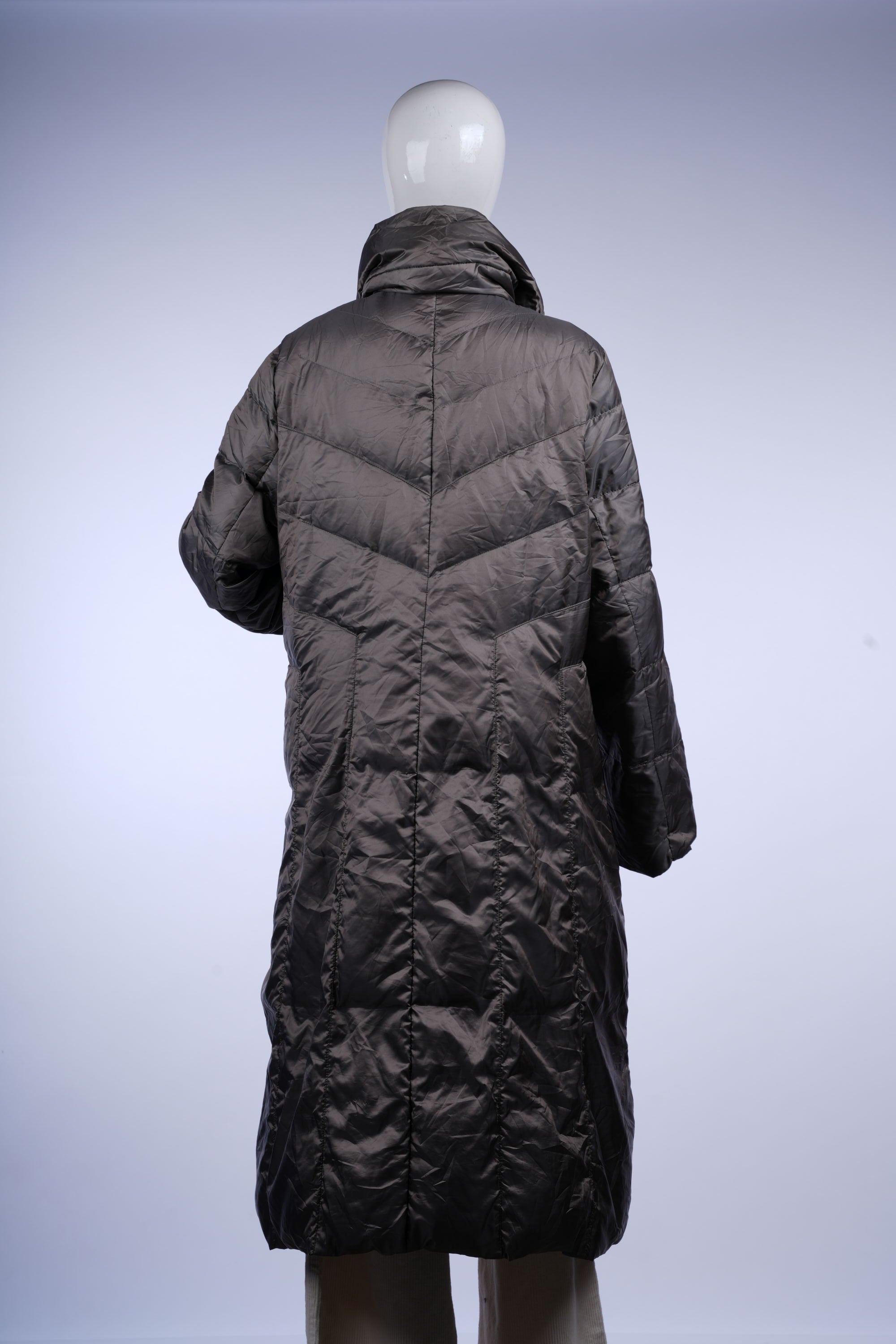 Insulated grey longline puffer coat with quilted pattern and stand-up collar, perfect for staying cozy in colder months.