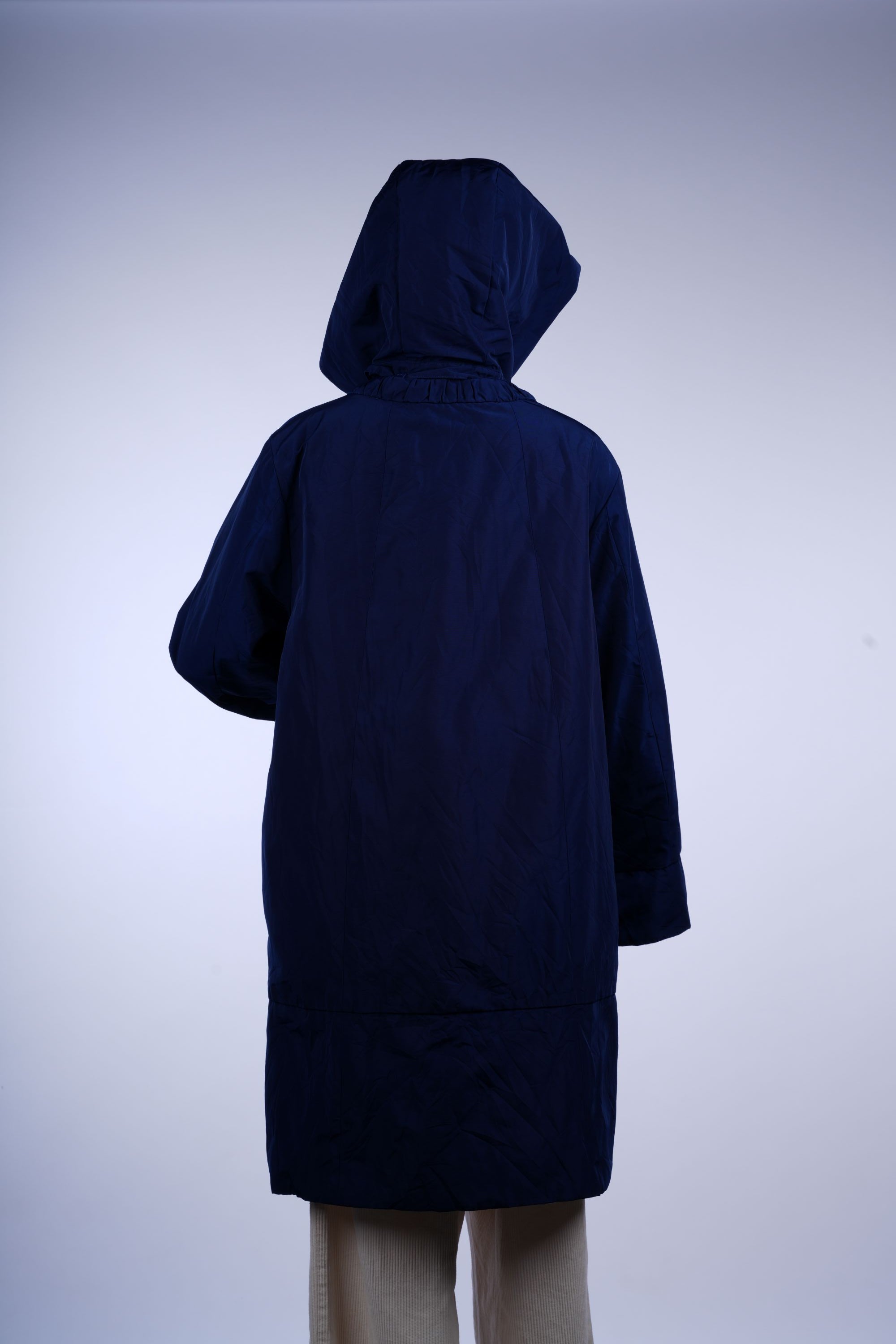 Sleek blue hooded raincoat with full-zip front and longline silhouette, perfect for staying dry in rain.