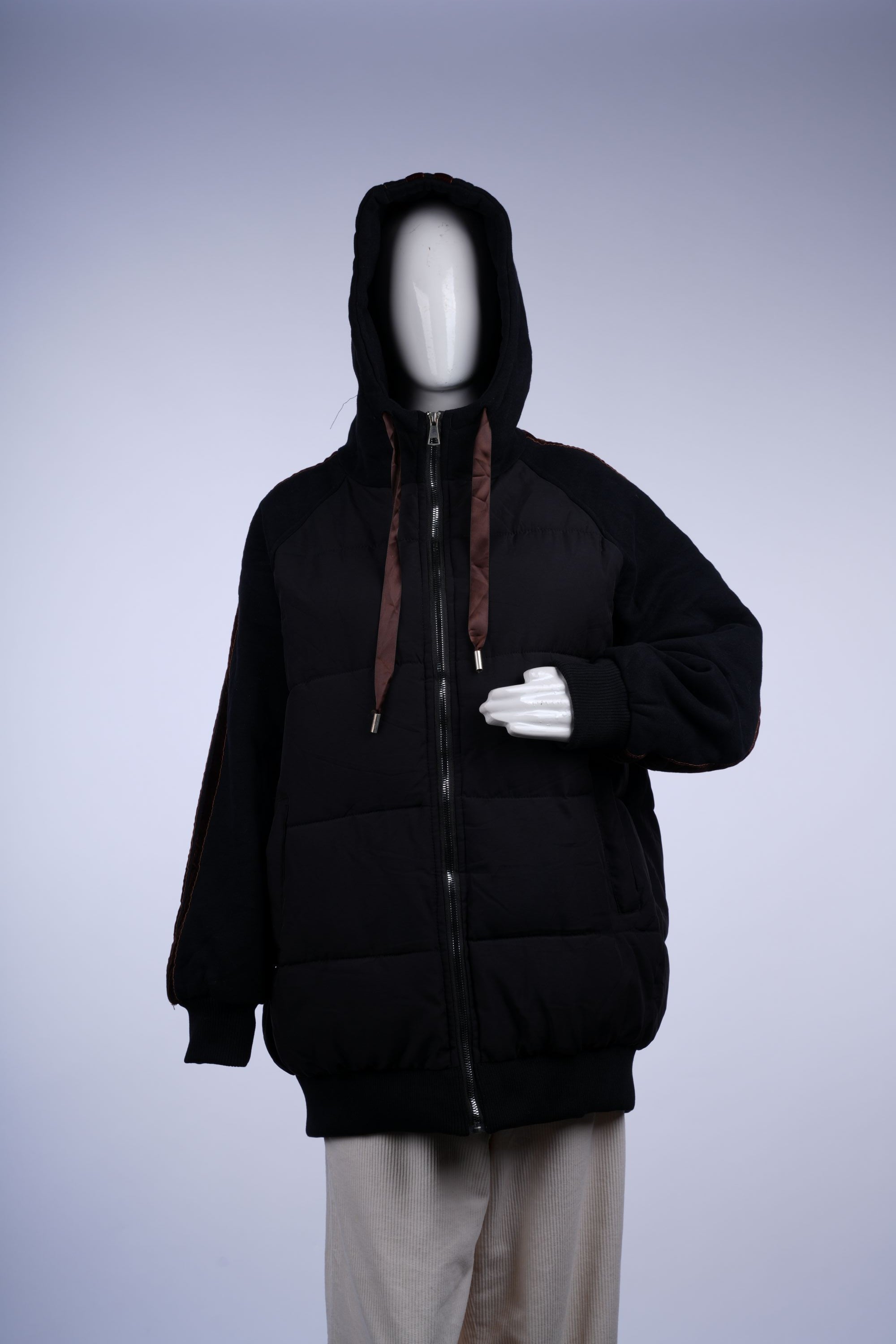 Black insulated puffer with horizontal quilting, hood, and zip-front, ideal for cold-weather casual wear.