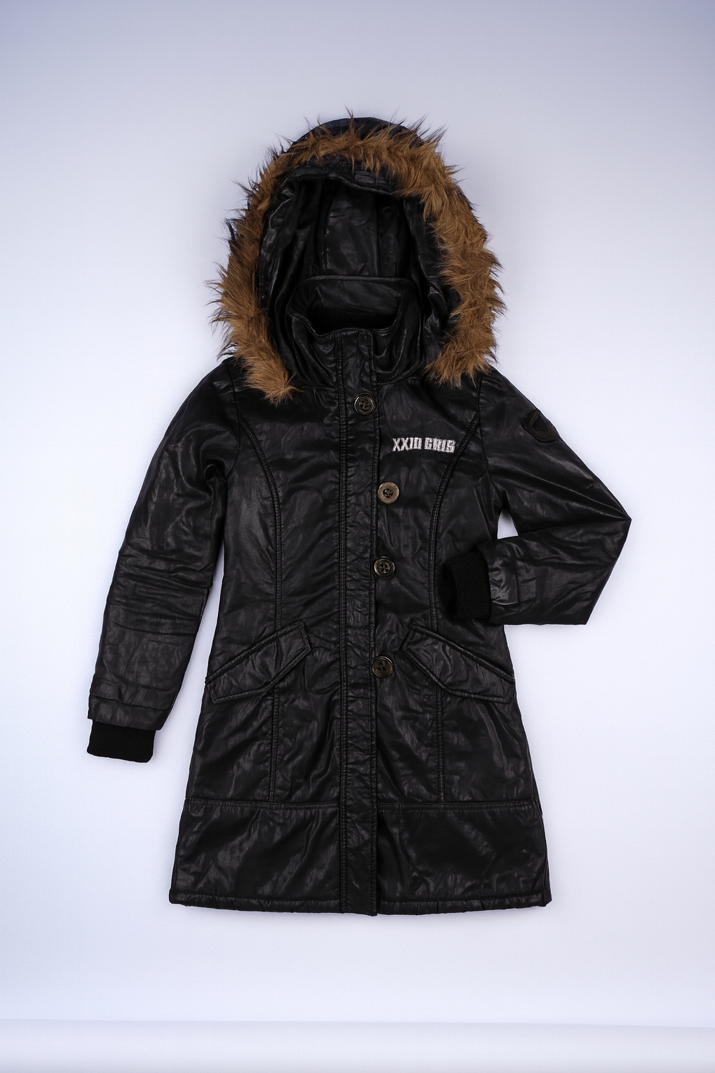 Black longline parka with fur-lined hood, full-zip front, and patch pockets for winter warmth and protection.