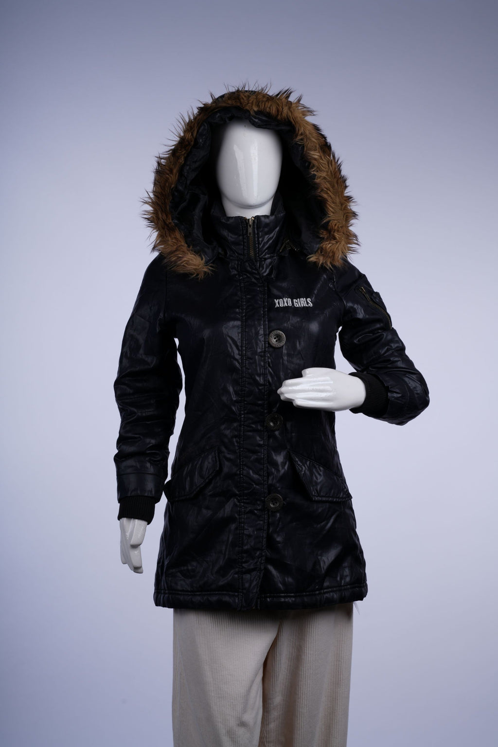 Hooded black parka featuring fur trim, zip closure, and front pockets, ideal for cold-weather wear.