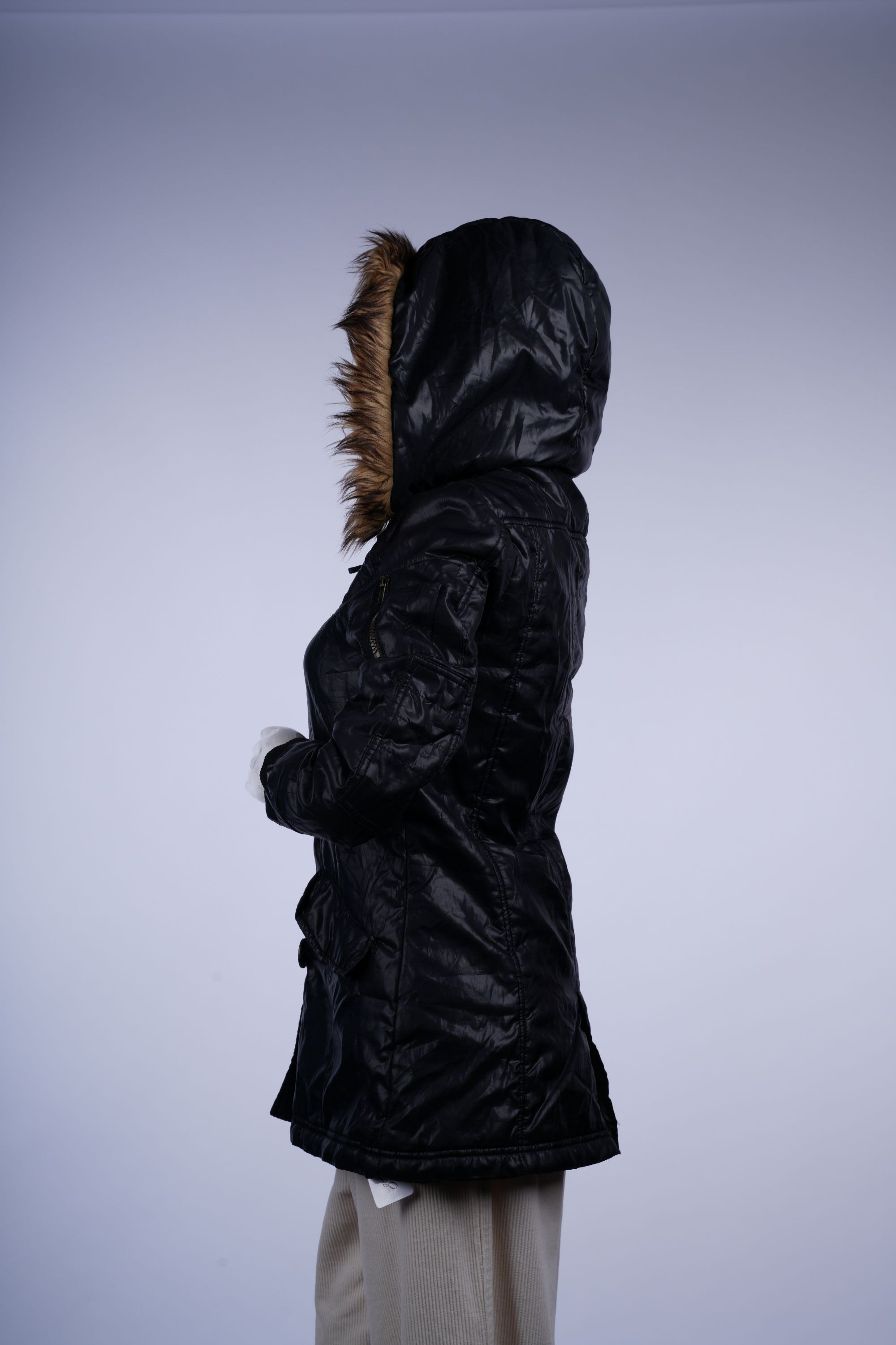 Warm black long parka with fur-lined hood, full-length zipper, and functional patch pockets for winter days.
