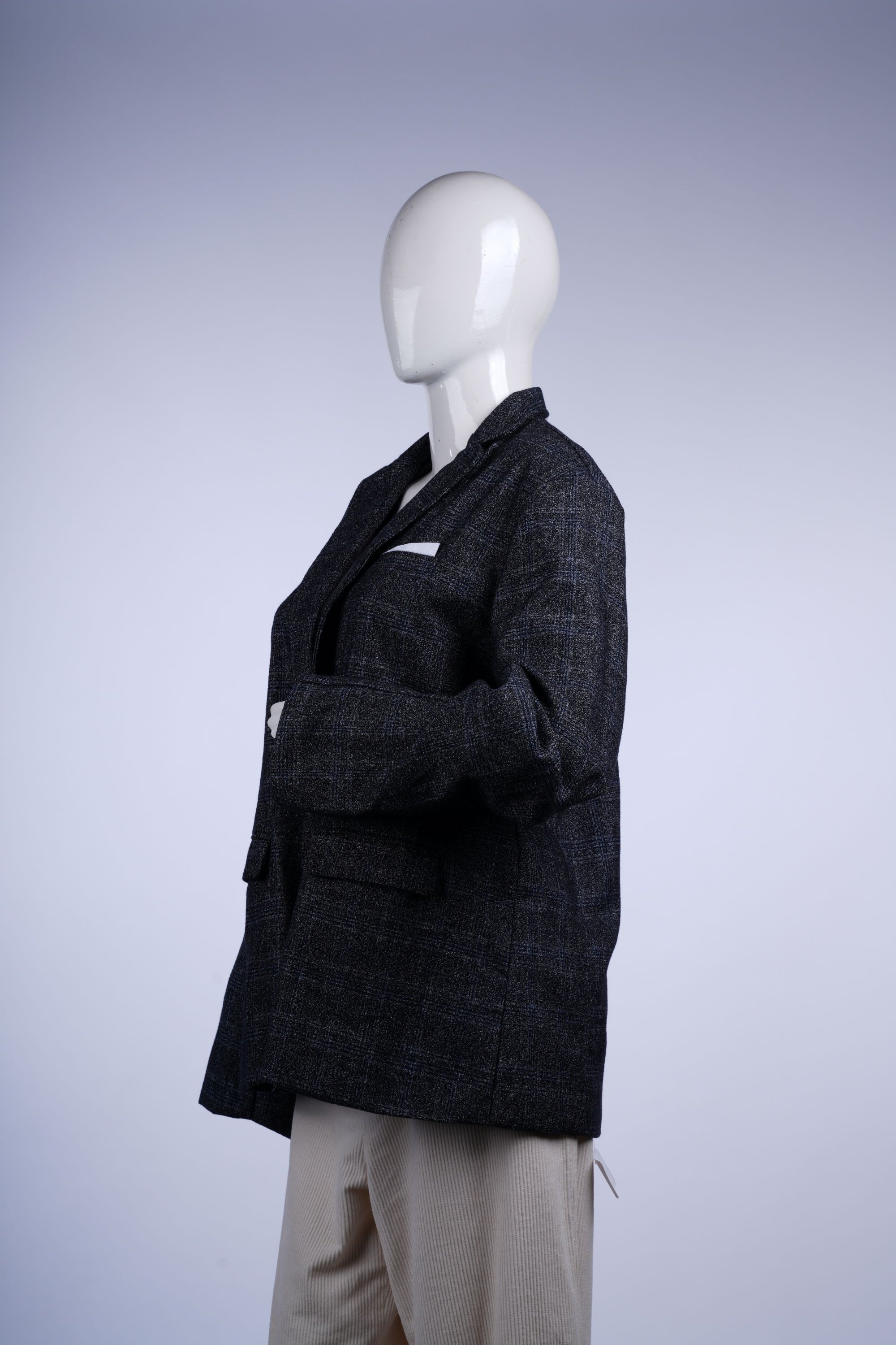 Stylish grey plaid blazer with single-breasted closure, notched lapels, flapped pockets, and bold purple inner lining.
