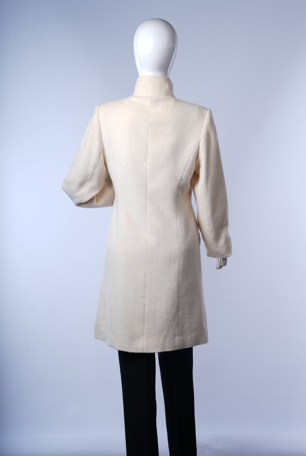 Chic women's ivory coat offering timeless style and sophistication