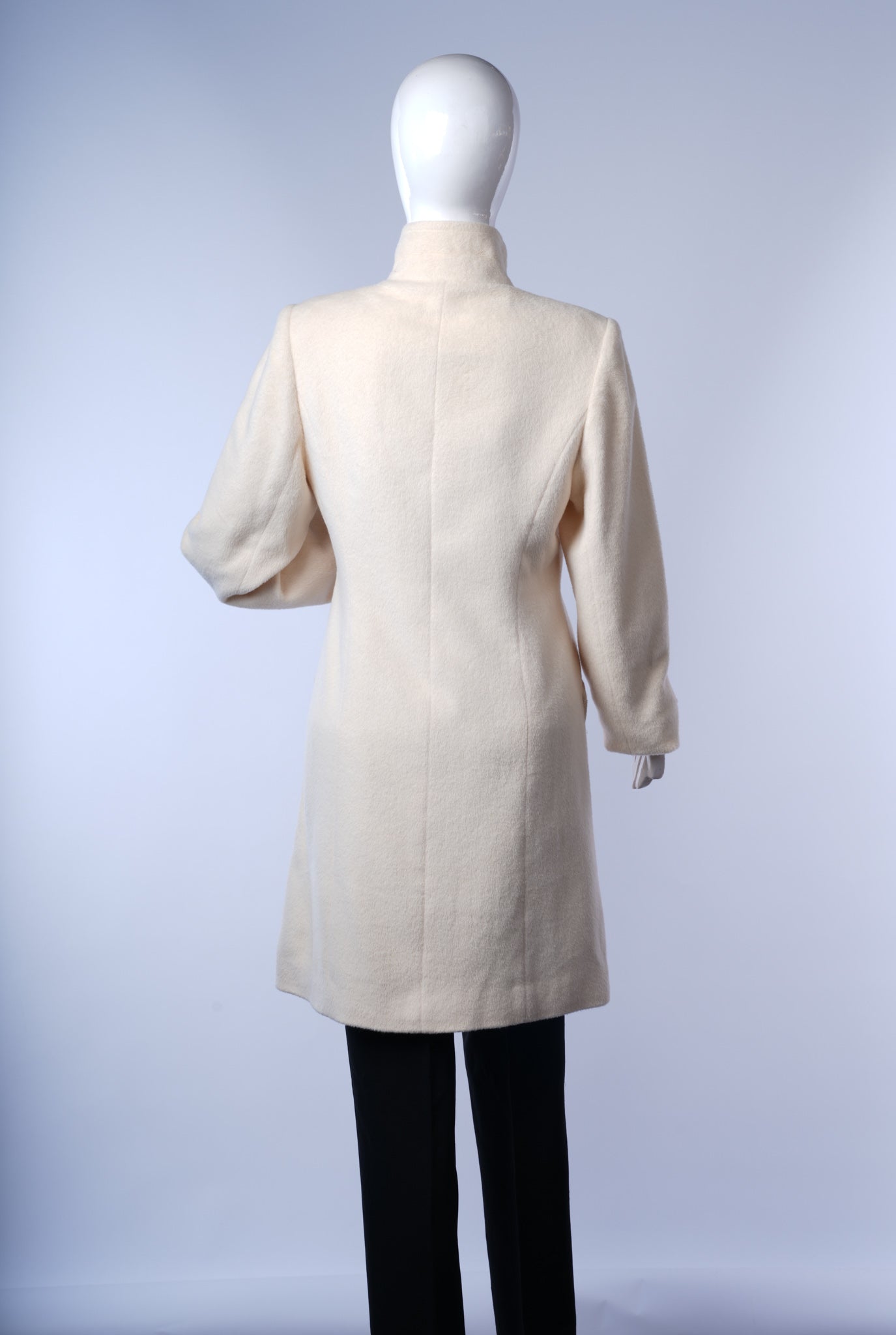 Chic women's ivory coat offering timeless style and sophistication