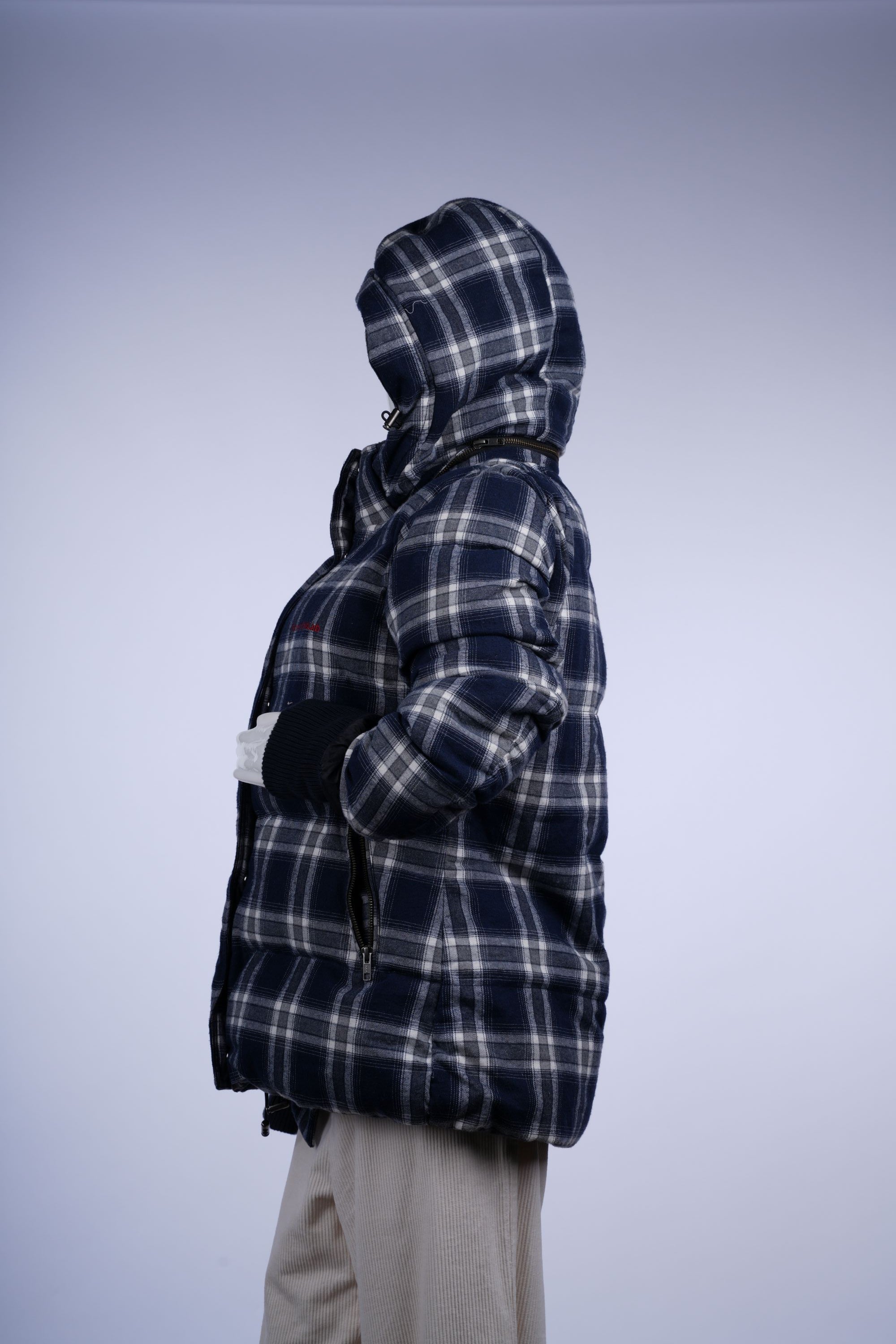 Insulated blue-and-white plaid hooded jacket with zip front and functional side pockets for versatile wear.