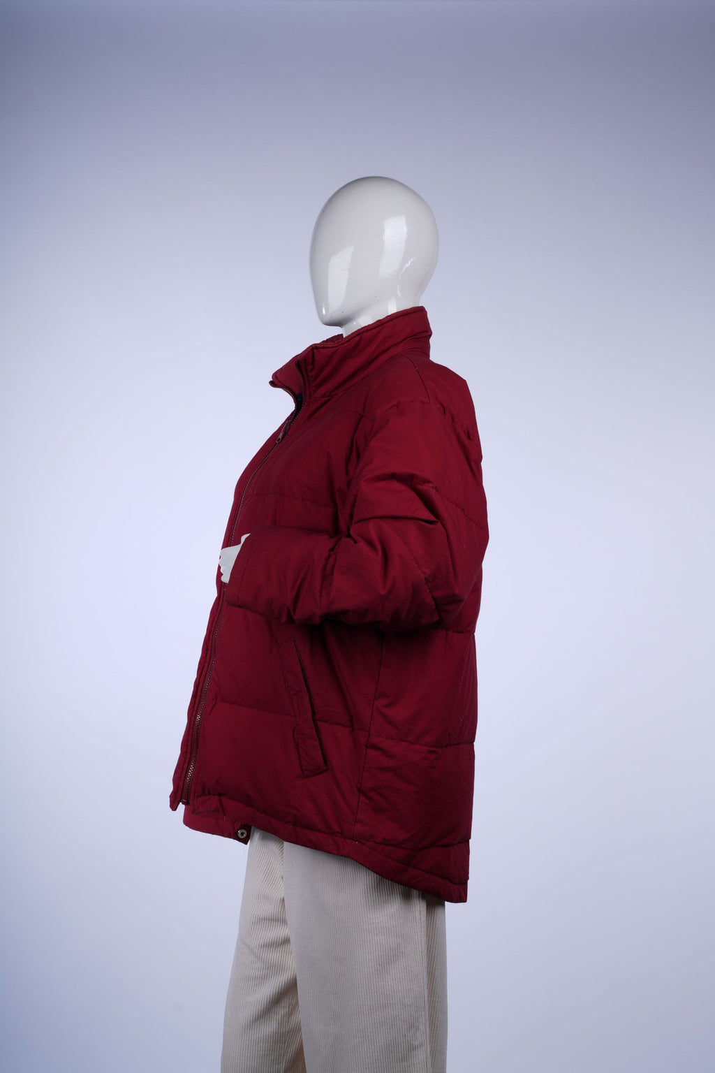 Casual deep red quilted jacket with full zip, stand collar, front pockets, and green-and-blue plaid interior.
