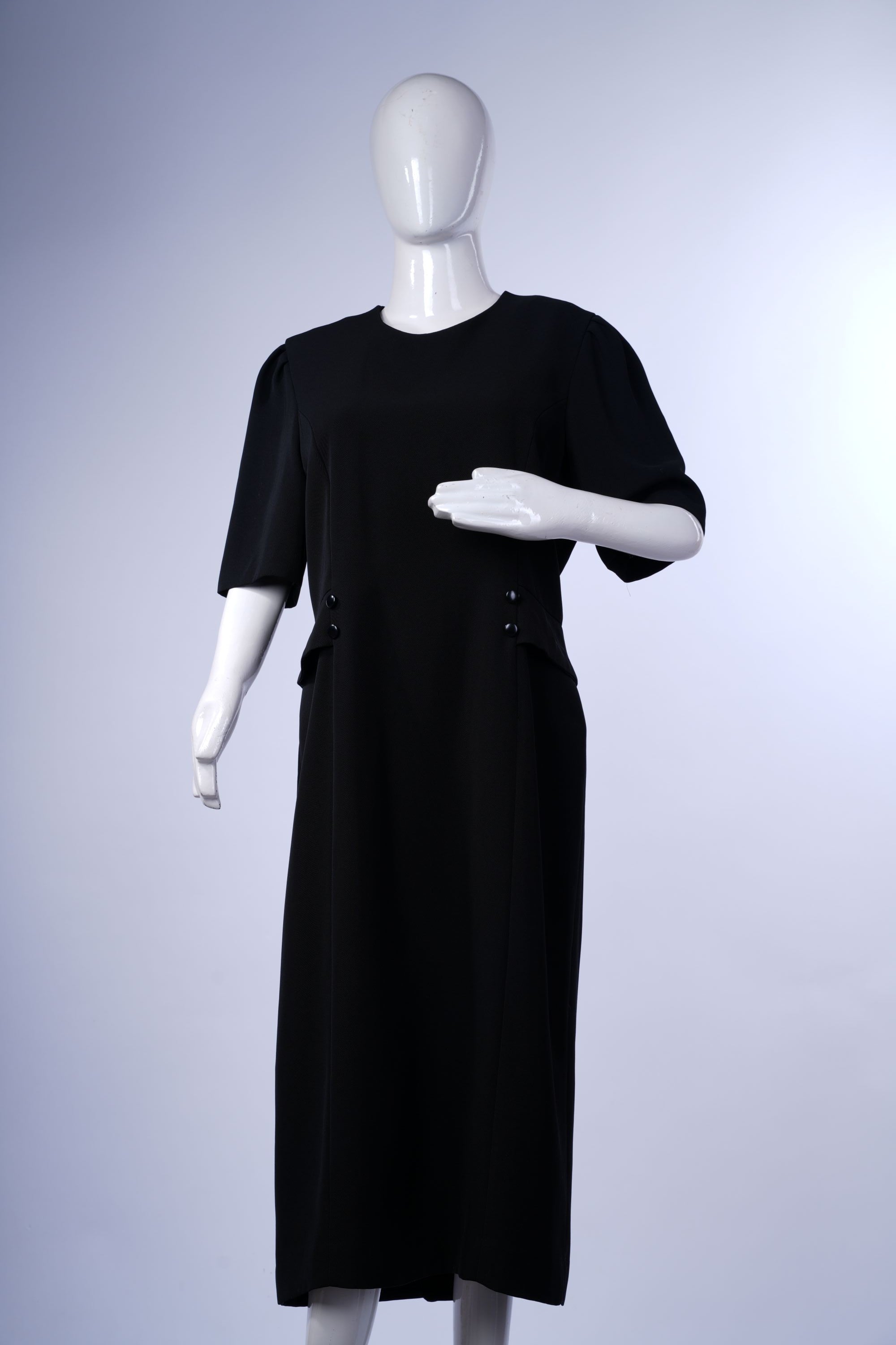 Chic black long-sleeve midi dress featuring a front slit and modern silhouette for versatile styling.