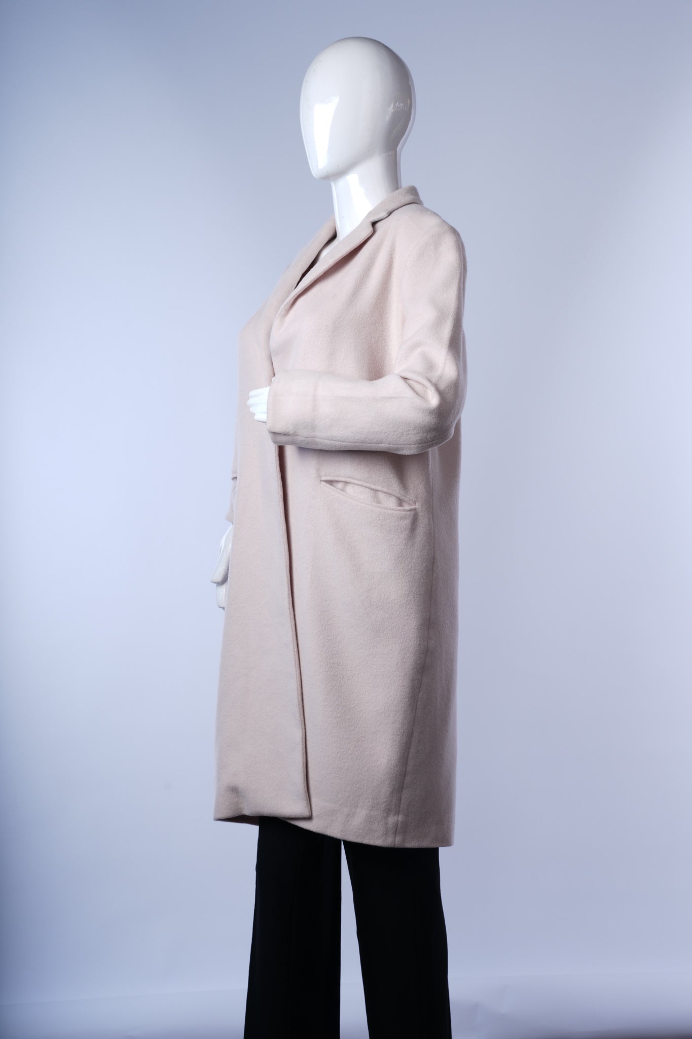 Elegant beige long coat for women, perfect for layered winter looks