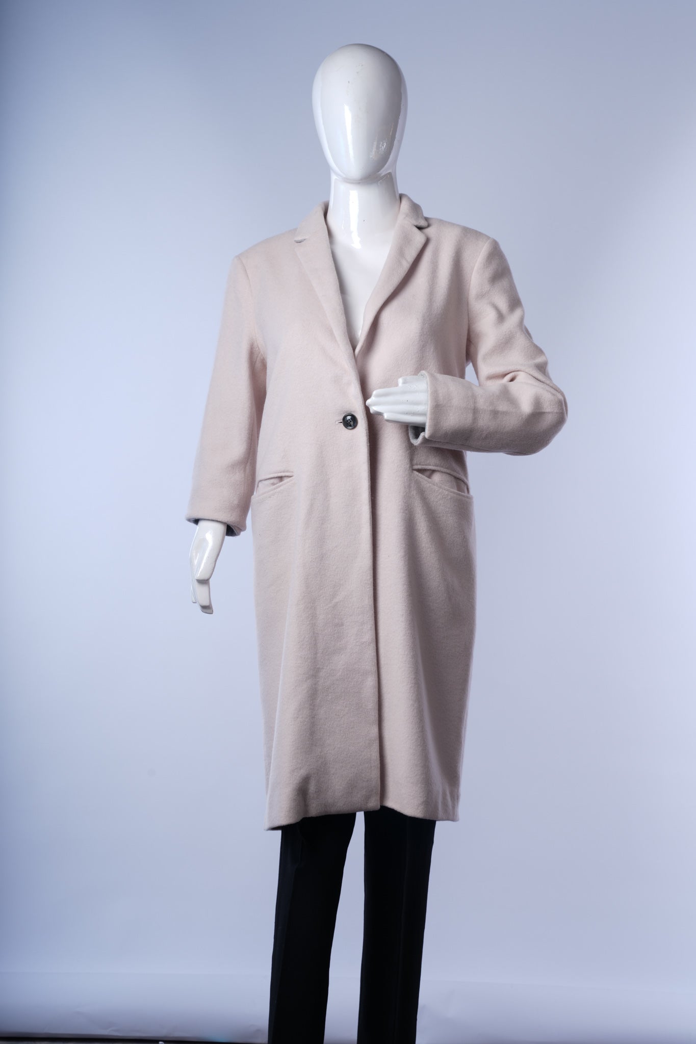 Timeless wool-blend beige coat offering sophisticated, versatile style