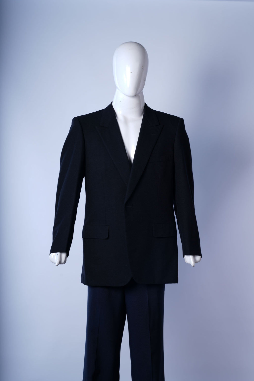 Men?s black blazer featuring classic tailoring and formal design.