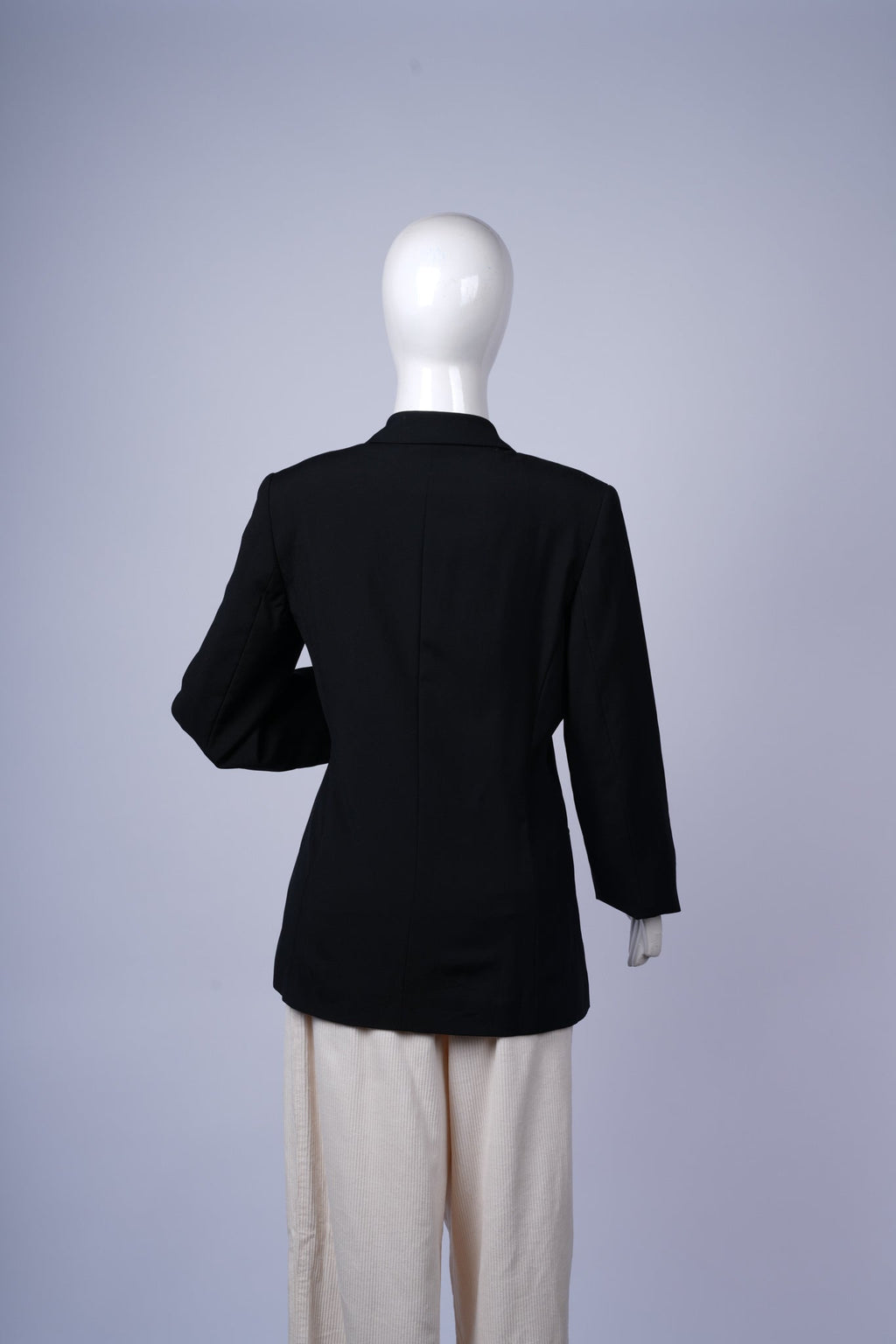 Versatile black two-button blazer perfect for professional and smart-casual styling.