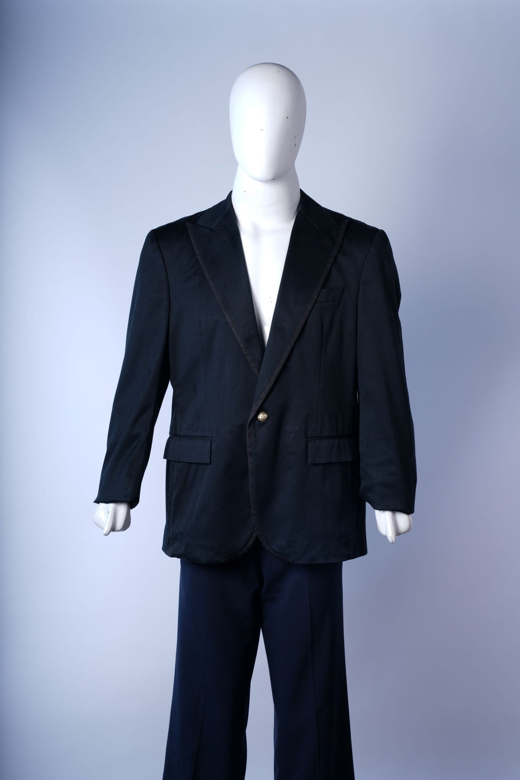 Men?s dark tailored blazer ideal for formal or business occasions.
