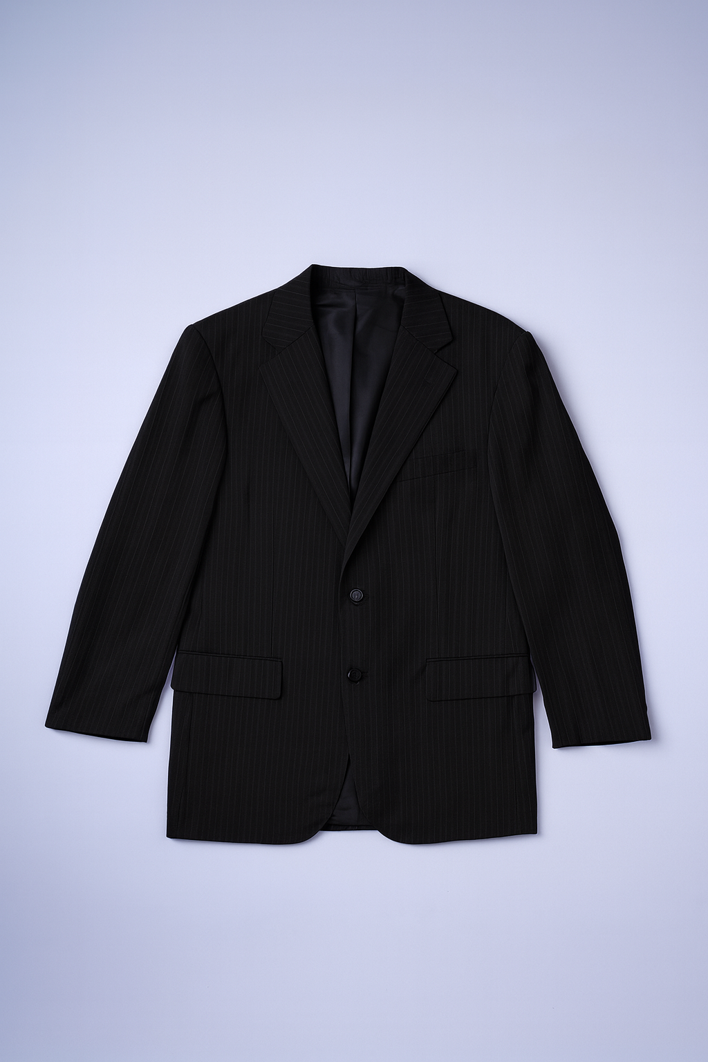 Dark pinstriped single-breasted blazer with notched lapels and flap pockets for men.