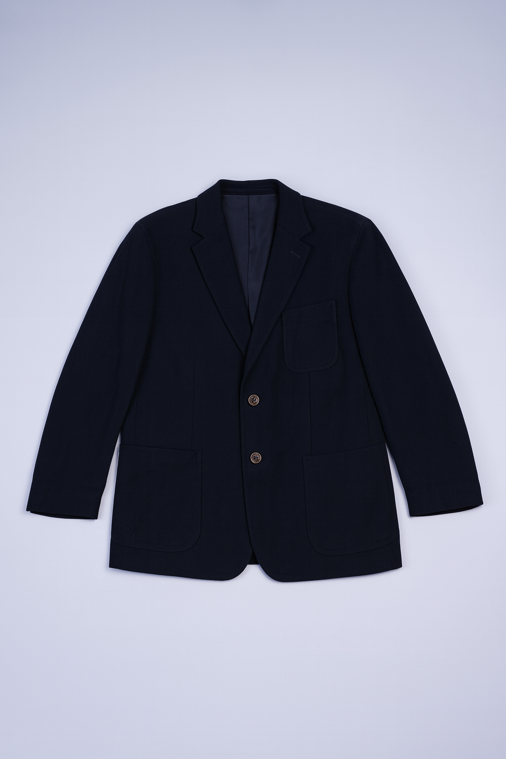 Single-breasted dark blazer with flap pockets and notched lapels for men.