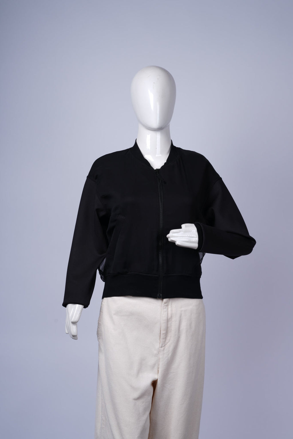 Minimalist black bomber jacket ideal for casual layering or streetwear.