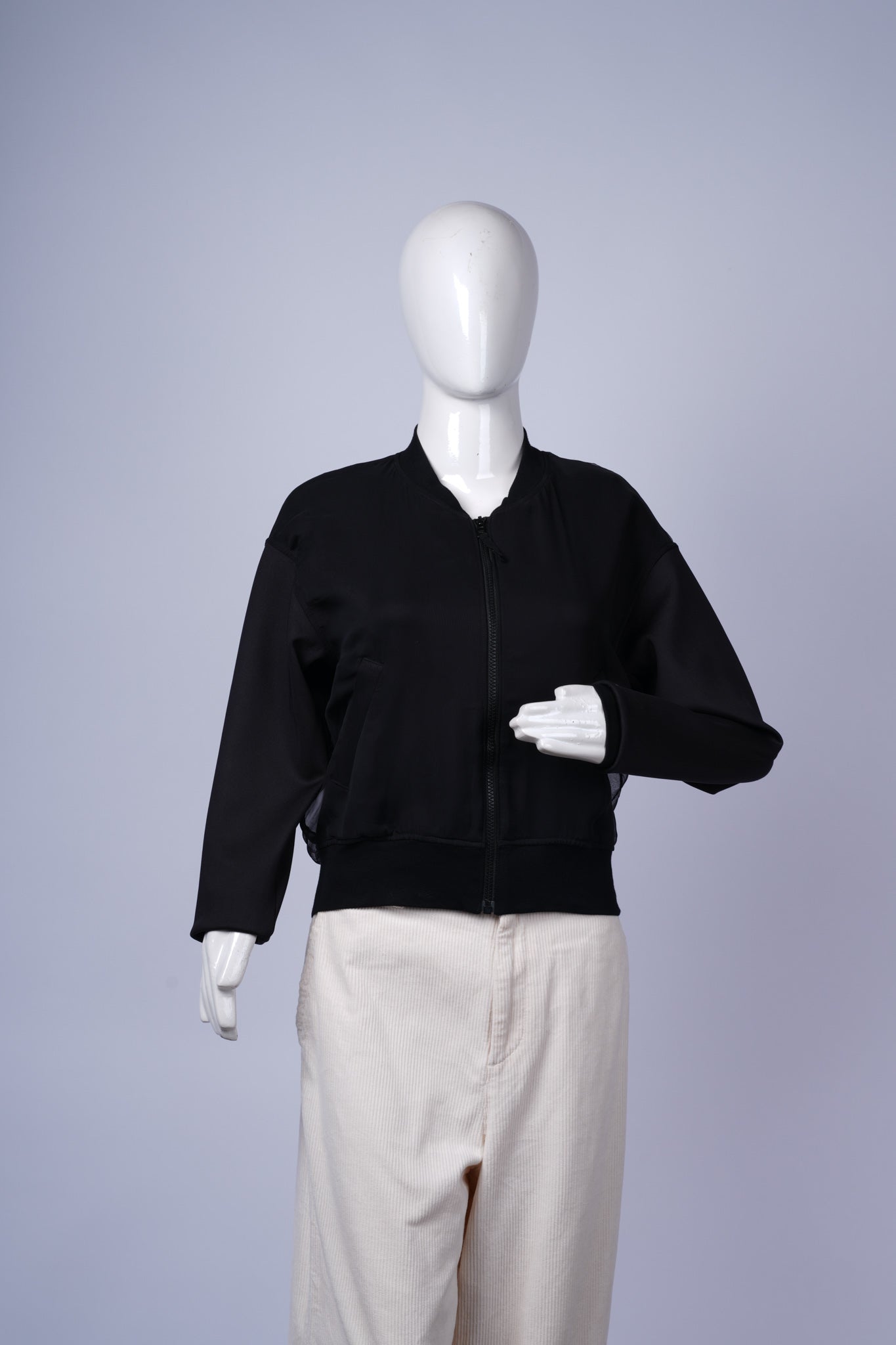 Minimalist black bomber jacket ideal for casual layering or streetwear.