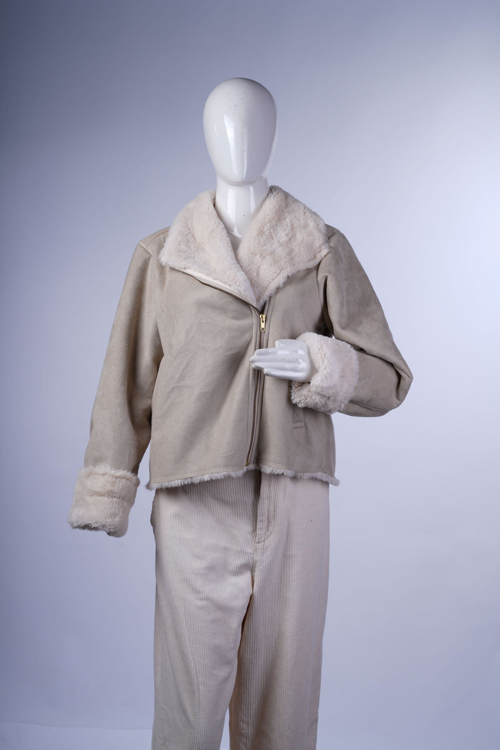 Vintage-inspired cream aviator-style jacket featuring cozy faux fur interior, wide collar, and subtle zip pockets.