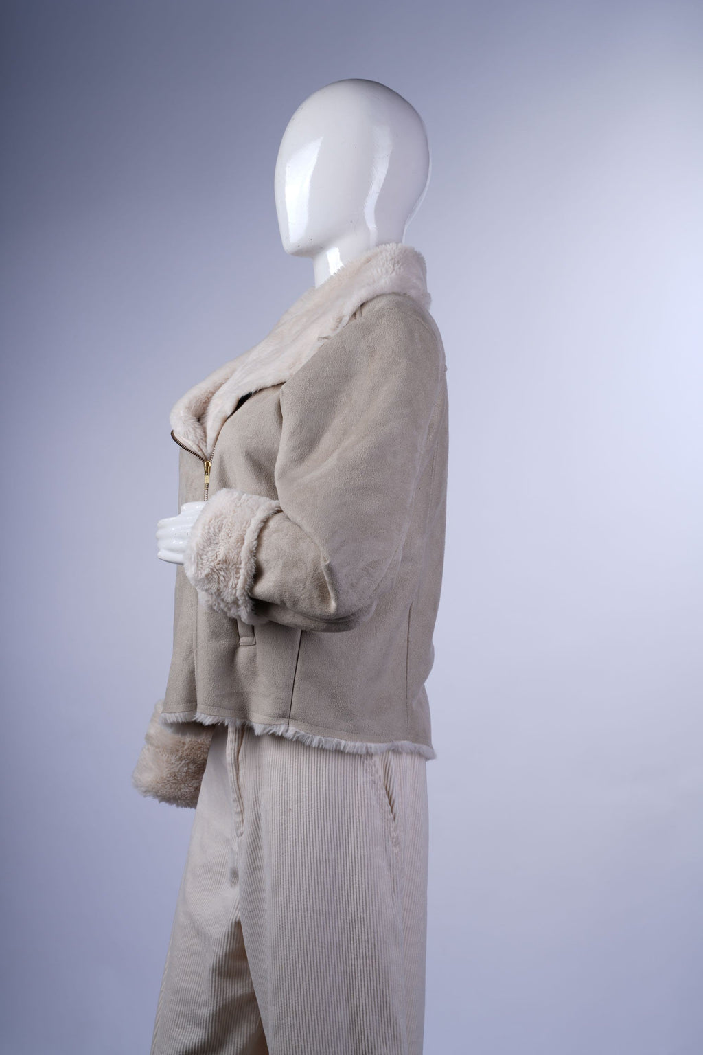 Warm cream aviator jacket with faux fur lining, wide collar, and zip-front closure, perfect for stylish layering.