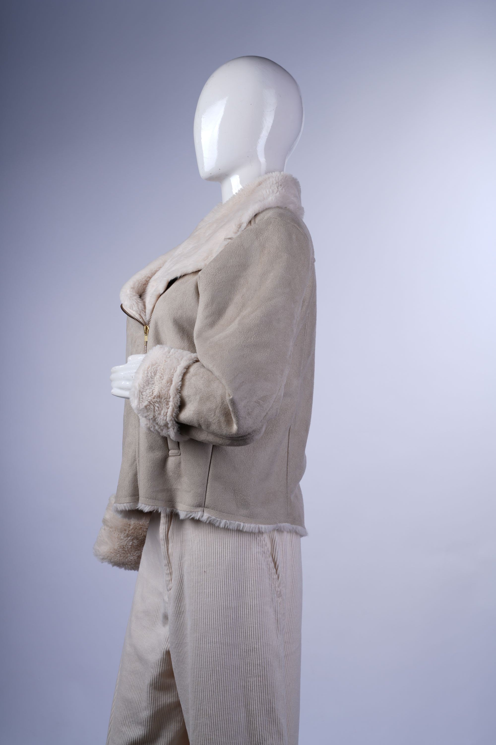 Warm cream aviator jacket with faux fur lining, wide collar, and zip-front closure, perfect for stylish layering.