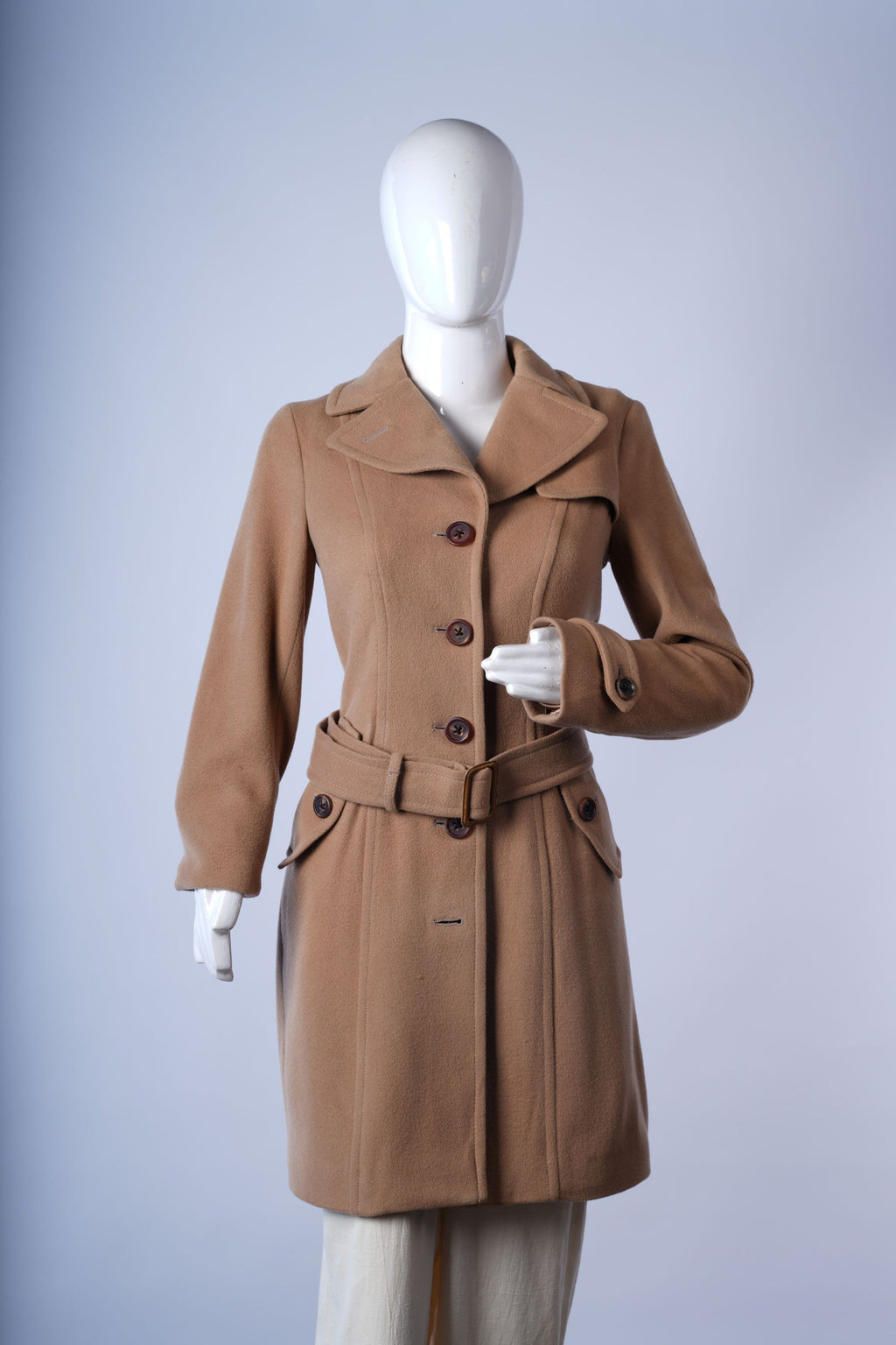 women's camel winter coat featuring polished silhouette, back vent, and tailored details.