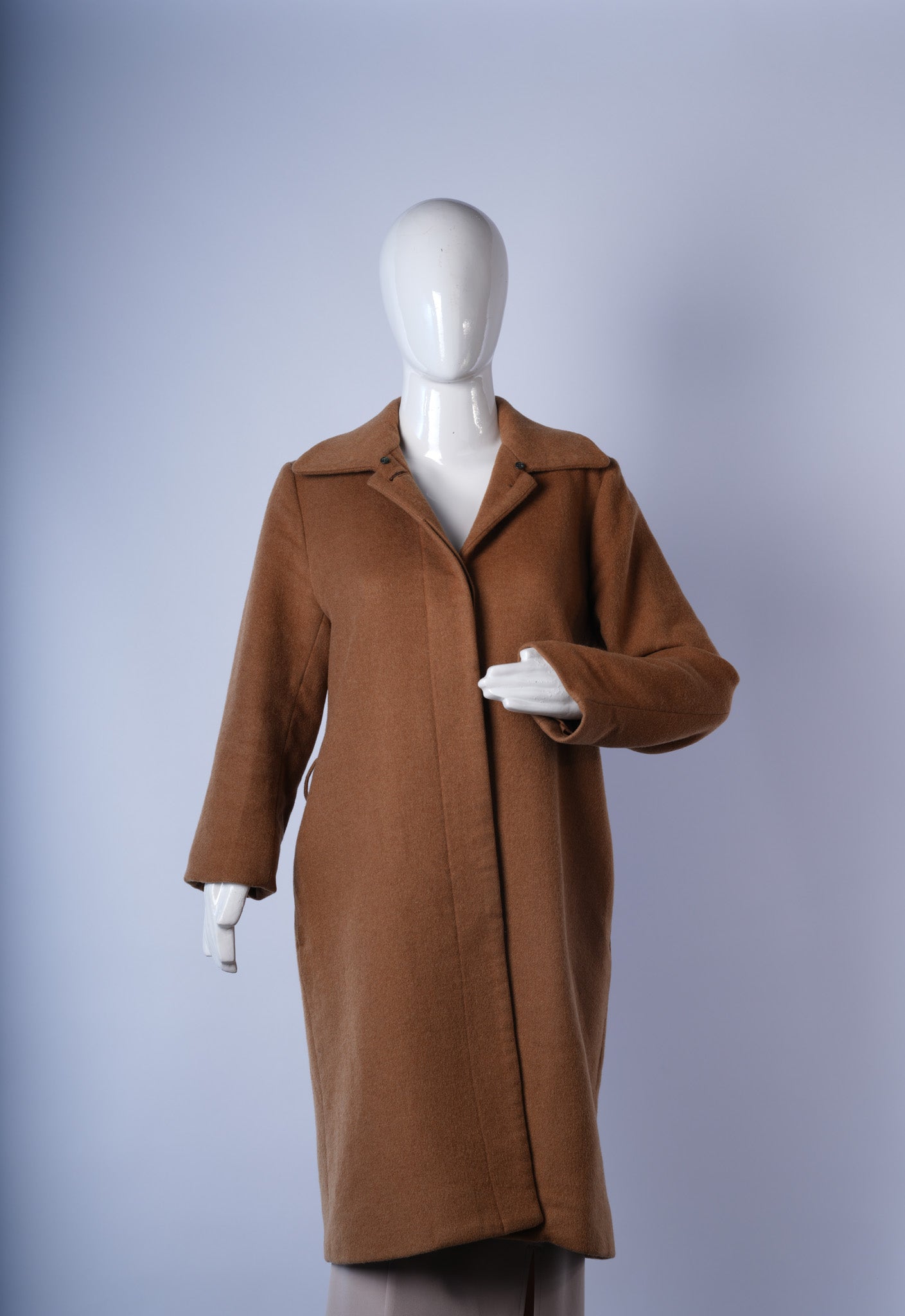 women's cozy beige faux-fur coat ideal for winter layering and chic styling.