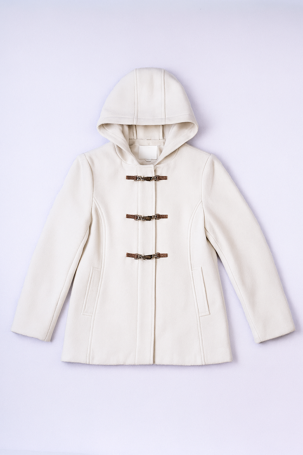 Elegant ivory longline overcoat in soft wool-blend fabric with wide lapels and side pockets.