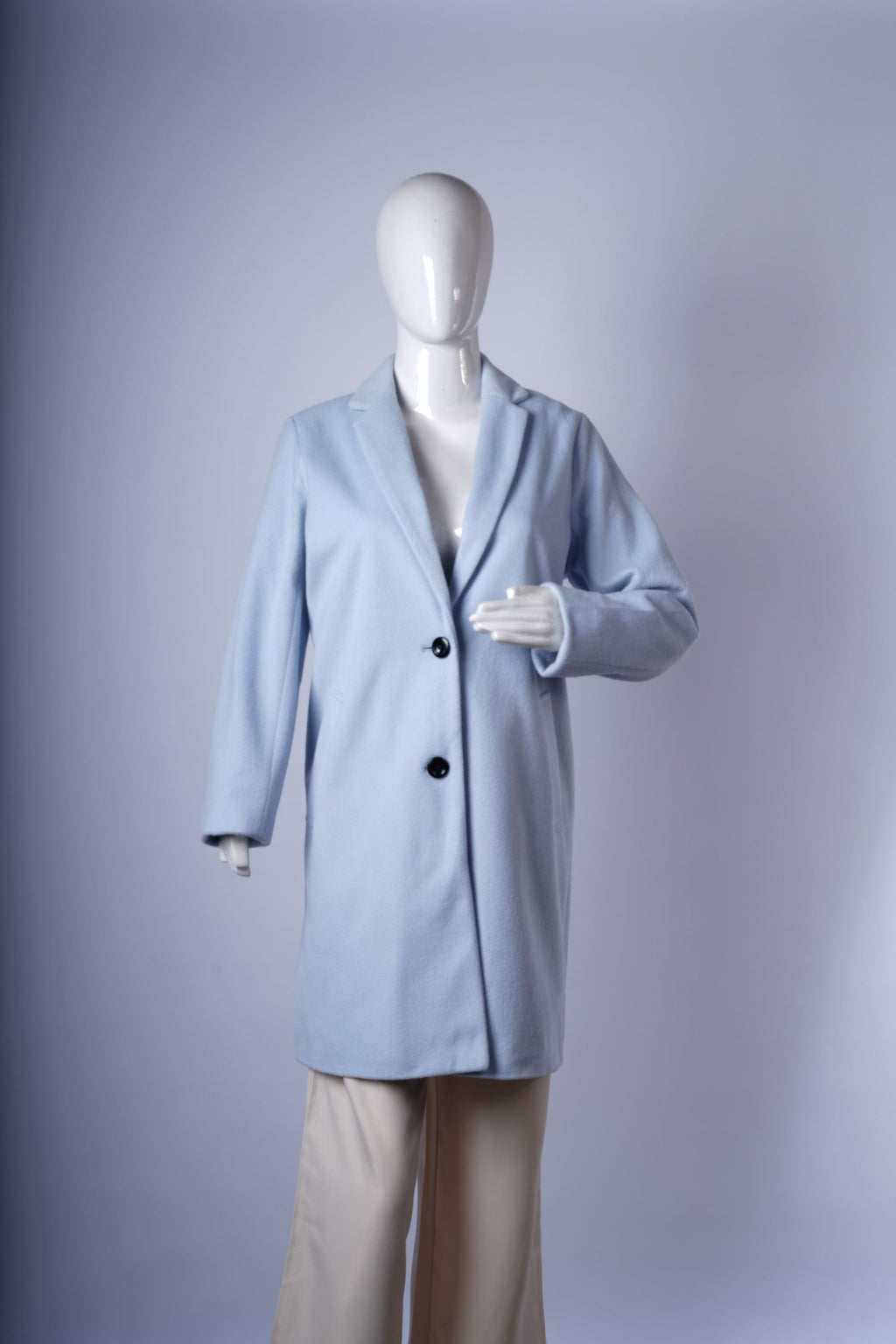 Elegant light blue wool-blend coat for women, featuring single-breasted design, notched lapels, and mid-thigh silhouette.