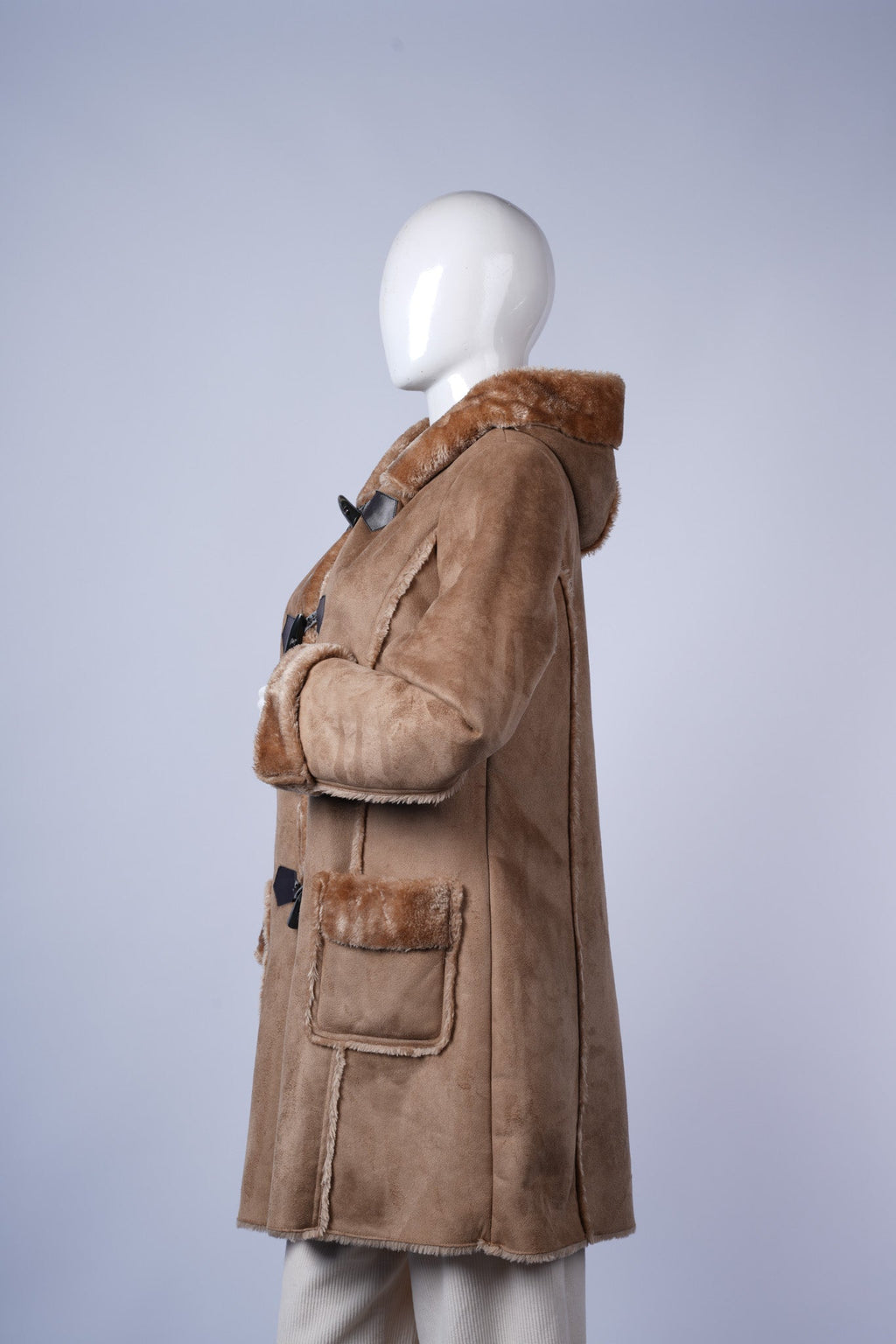 Classic oversized plaid blazer with tailored details and versatile brown tones.