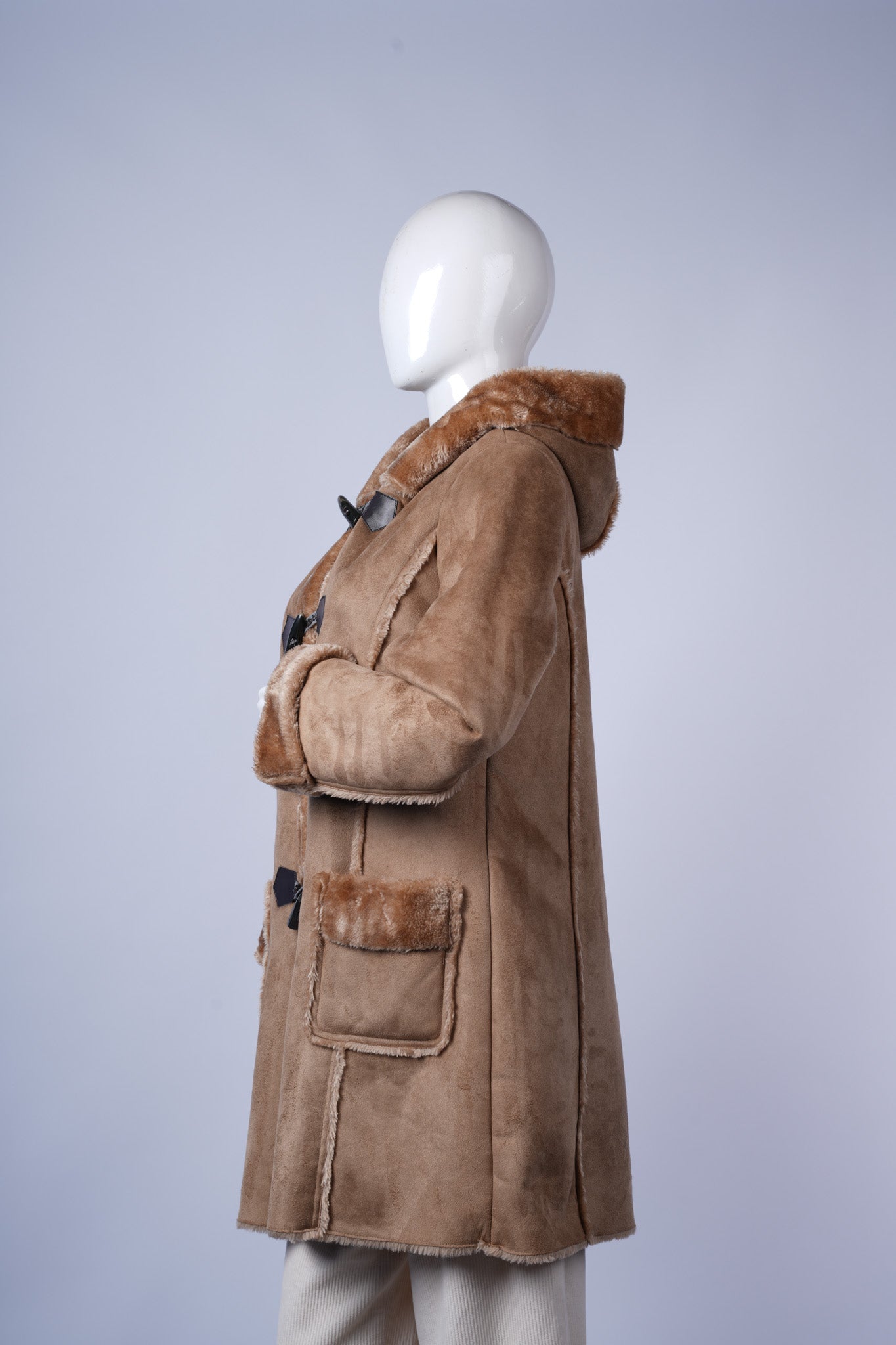 Classic oversized plaid blazer with tailored details and versatile brown tones.