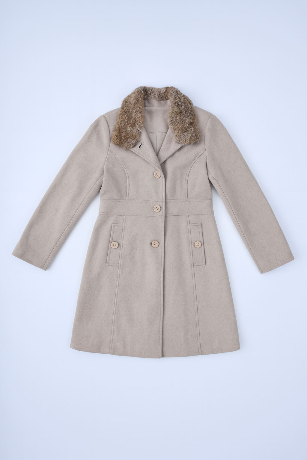 Longline black puffer coat with quilted detailing, detachable hood, and front zip closure.