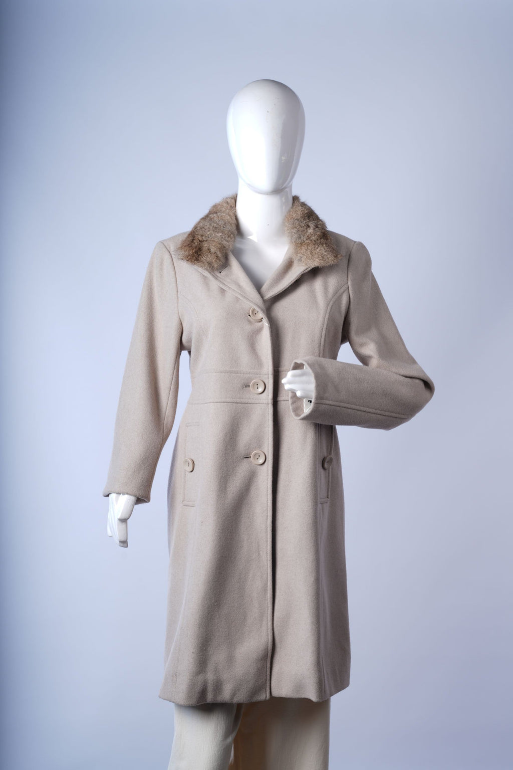 women's black puffer coat designed for full-body warmth in harsh winter conditions.