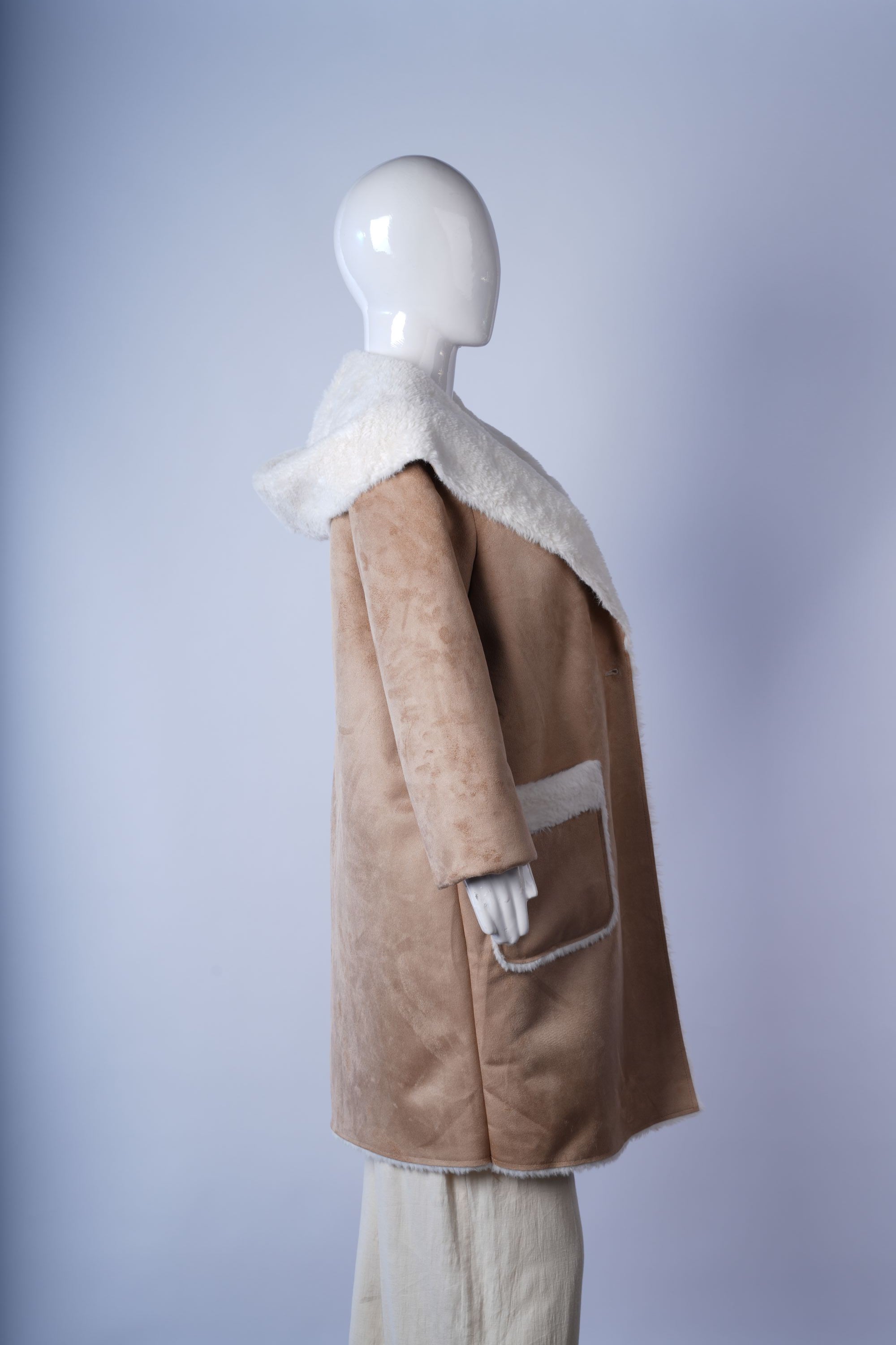 Elegant beige trench coat featuring tailored design, belt, and button closure.