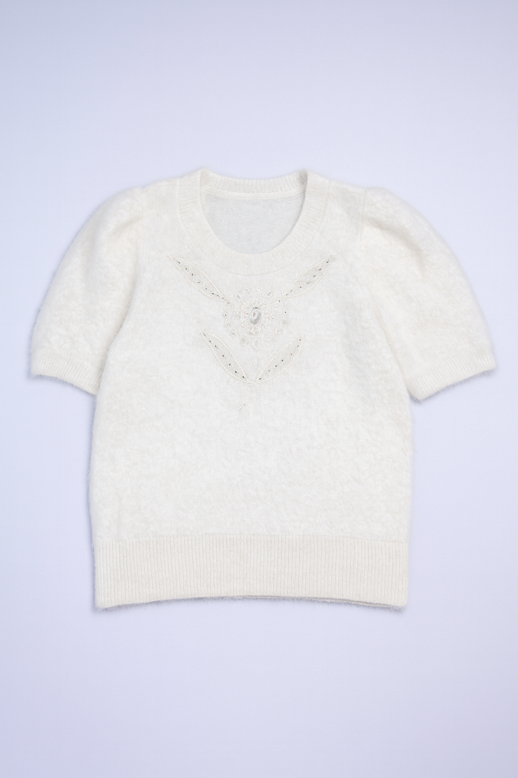 women's white fuzzy knit short-sleeve sweater with jeweled neckline for a chic touch.