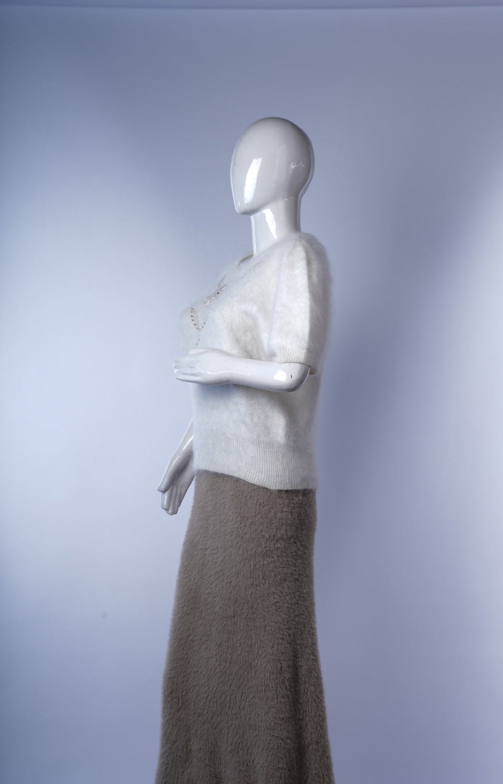 Short-sleeve fuzzy sweater adding subtle sparkle and texture to everyday outfits.